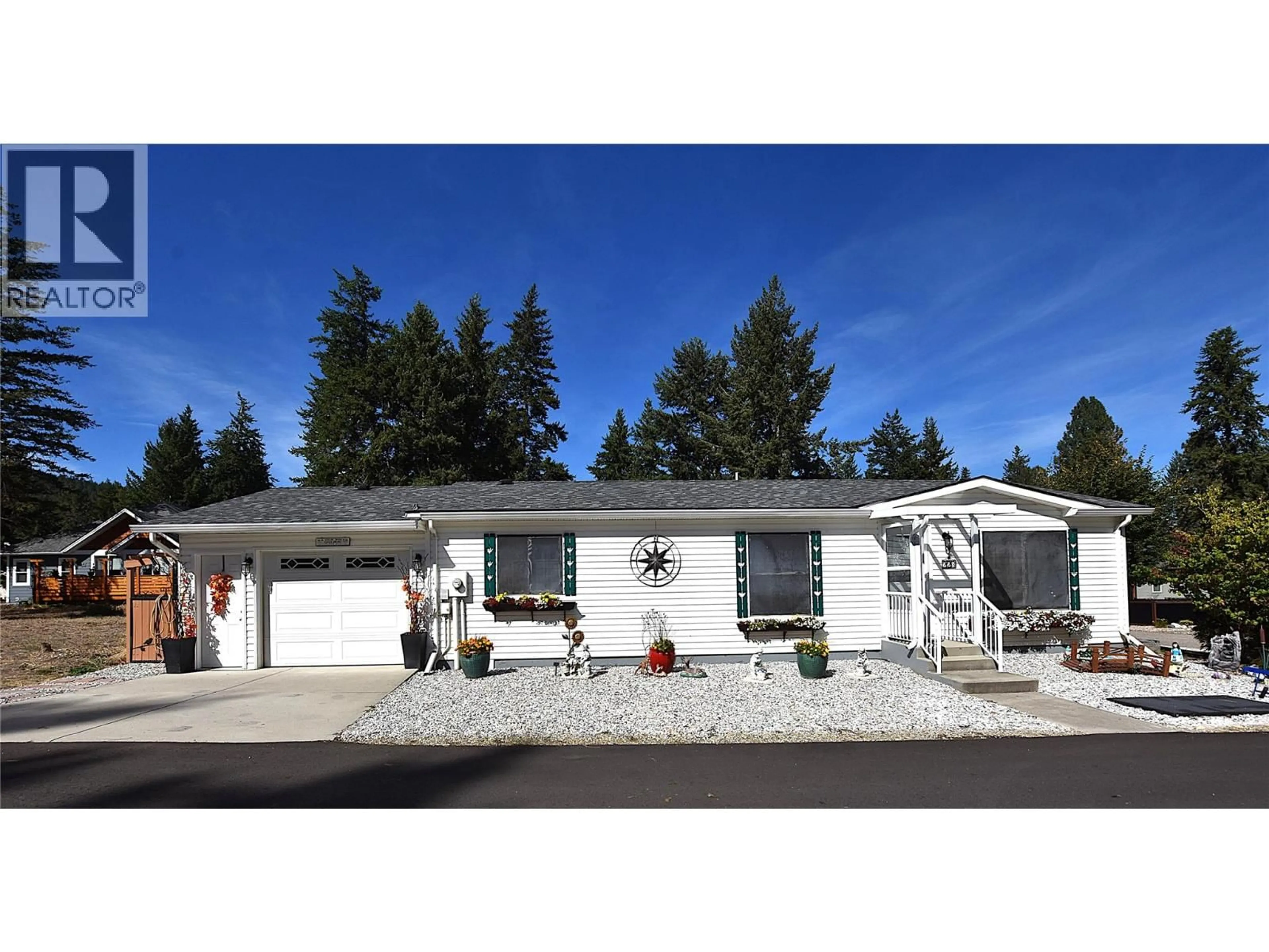 Home with vinyl exterior material, street for 223 COUGAR STREET, Vernon British Columbia V1H2A1