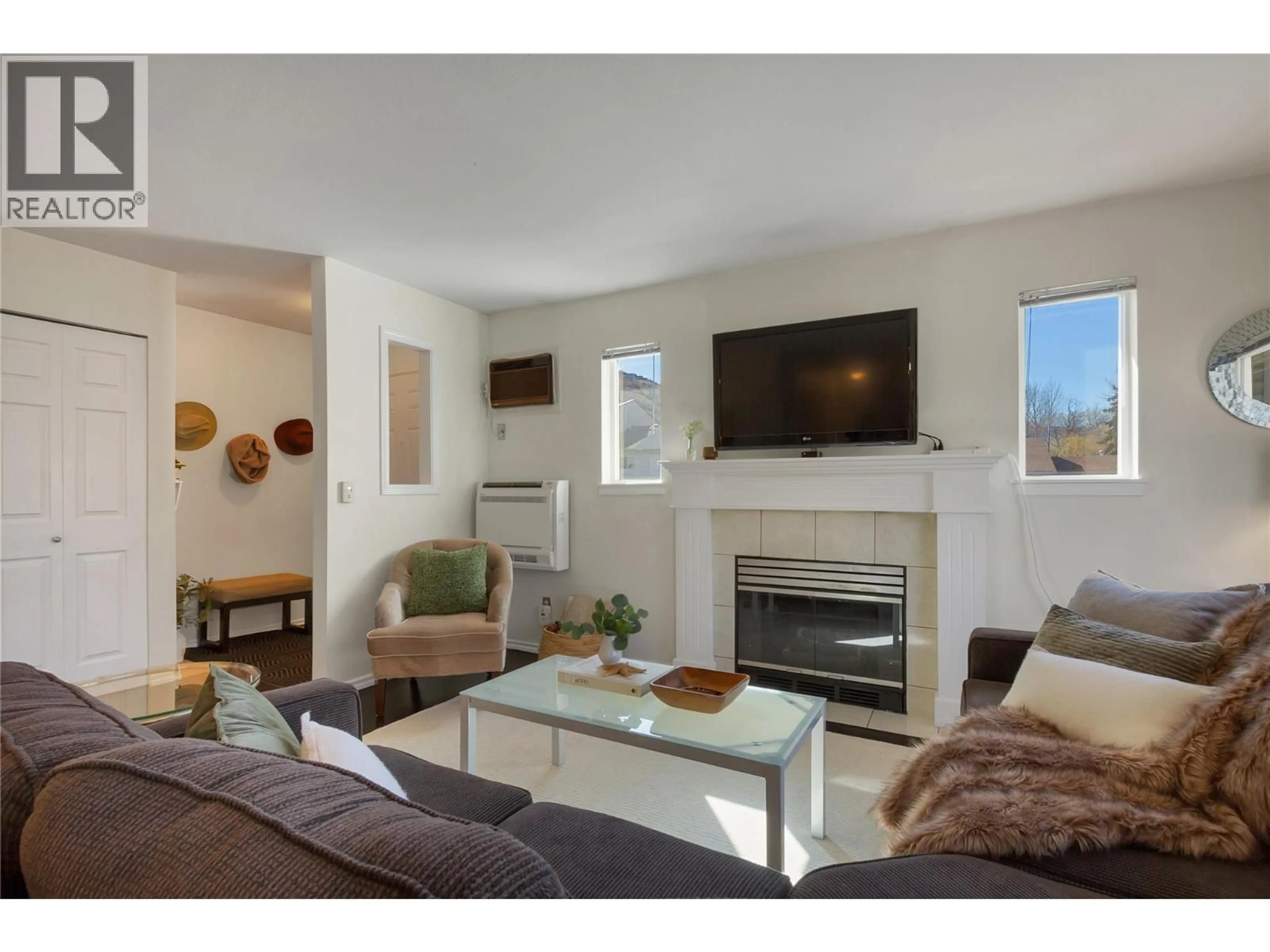 Living room with furniture, wood/laminate floor for 201 - 505 BROWNE ROAD, Vernon British Columbia V1T7M2