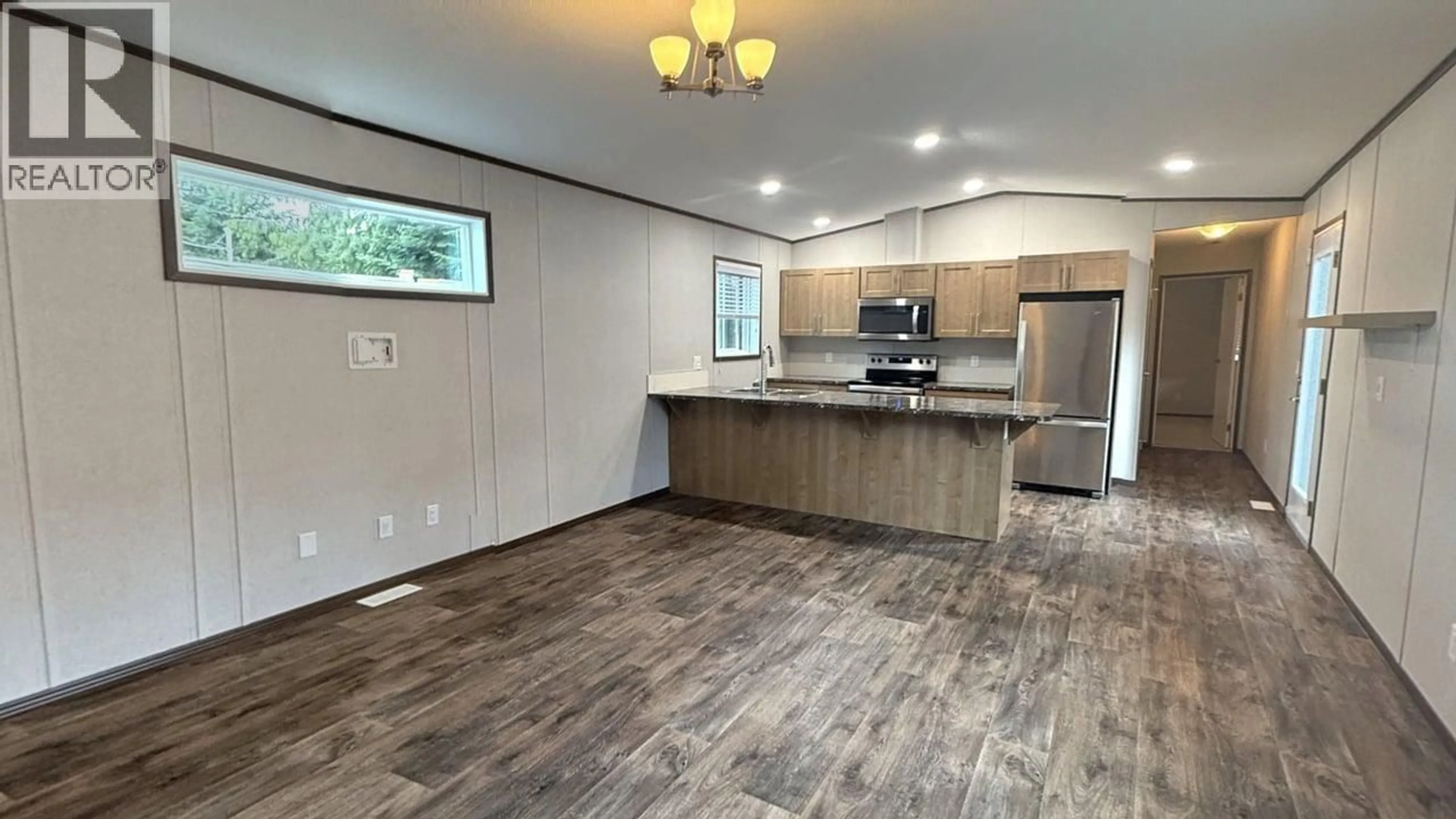 Open concept kitchen, wood/laminate floor for 8 - 891 MONTE VISTA DRIVE, Rossland British Columbia V0G1Y0