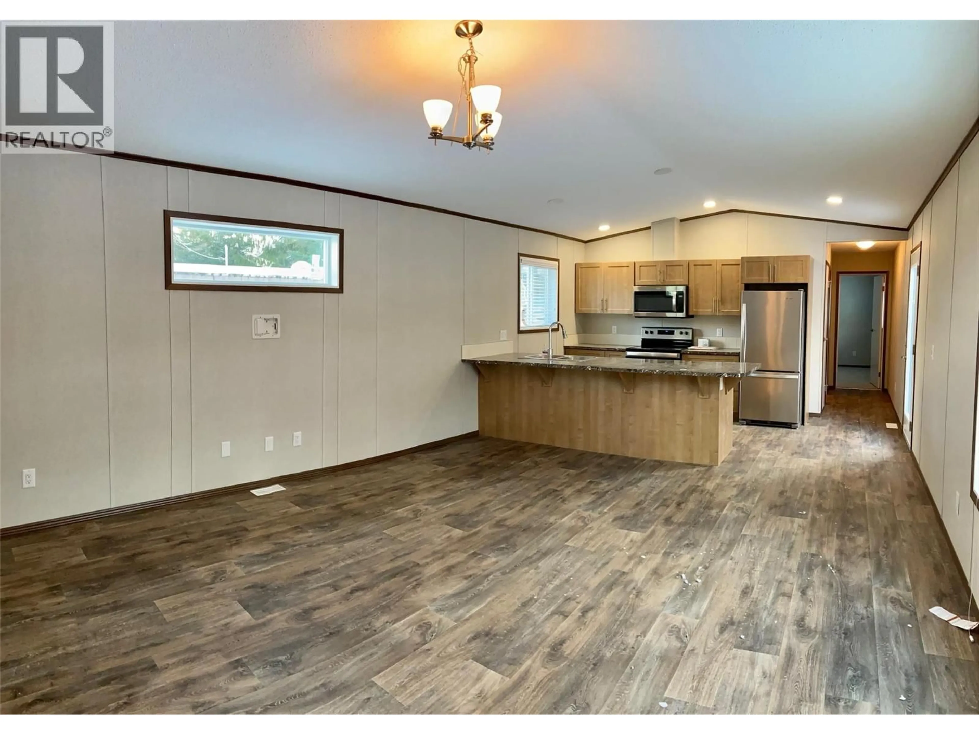 Open concept kitchen, wood/laminate floor for 8 - 891 MONTE VISTA DRIVE, Rossland British Columbia V0G1Y0