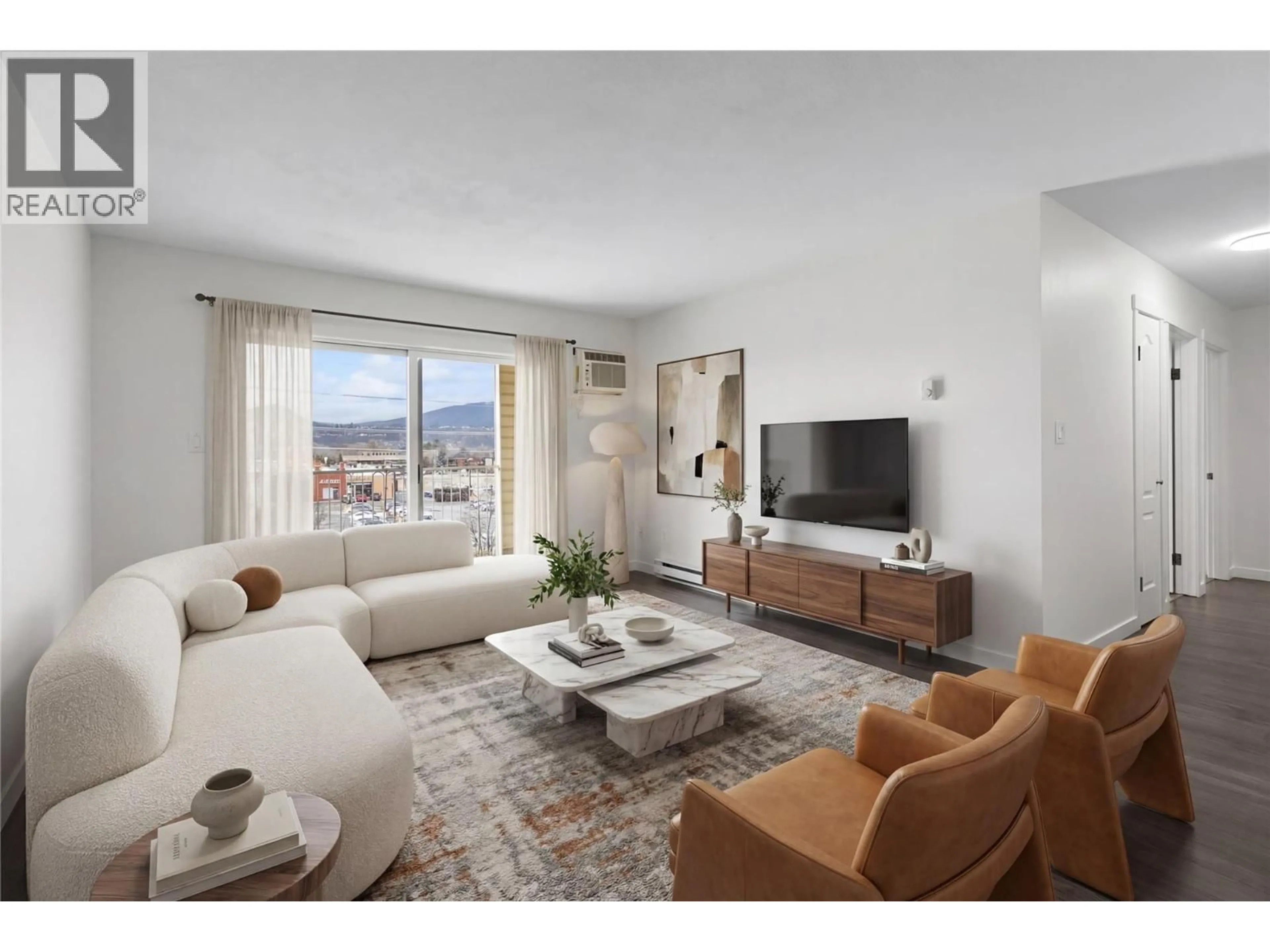 Living room with furniture, unknown for 402 - 769 KLO ROAD, Kelowna British Columbia V1Y9L9