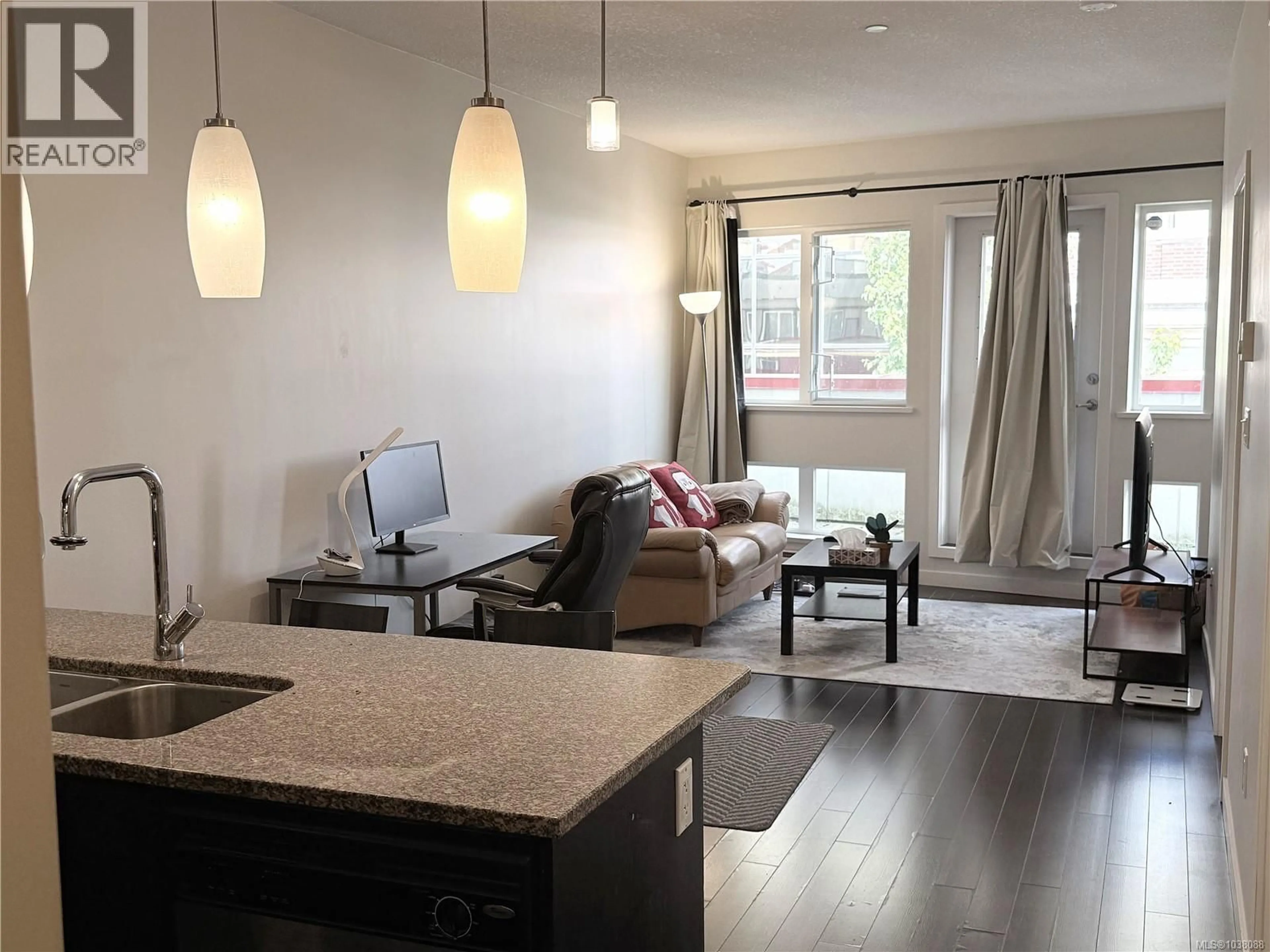 Living room with furniture, wood/laminate floor for 412 - 99 CHAPEL STREET, Nanaimo British Columbia V9R5H3