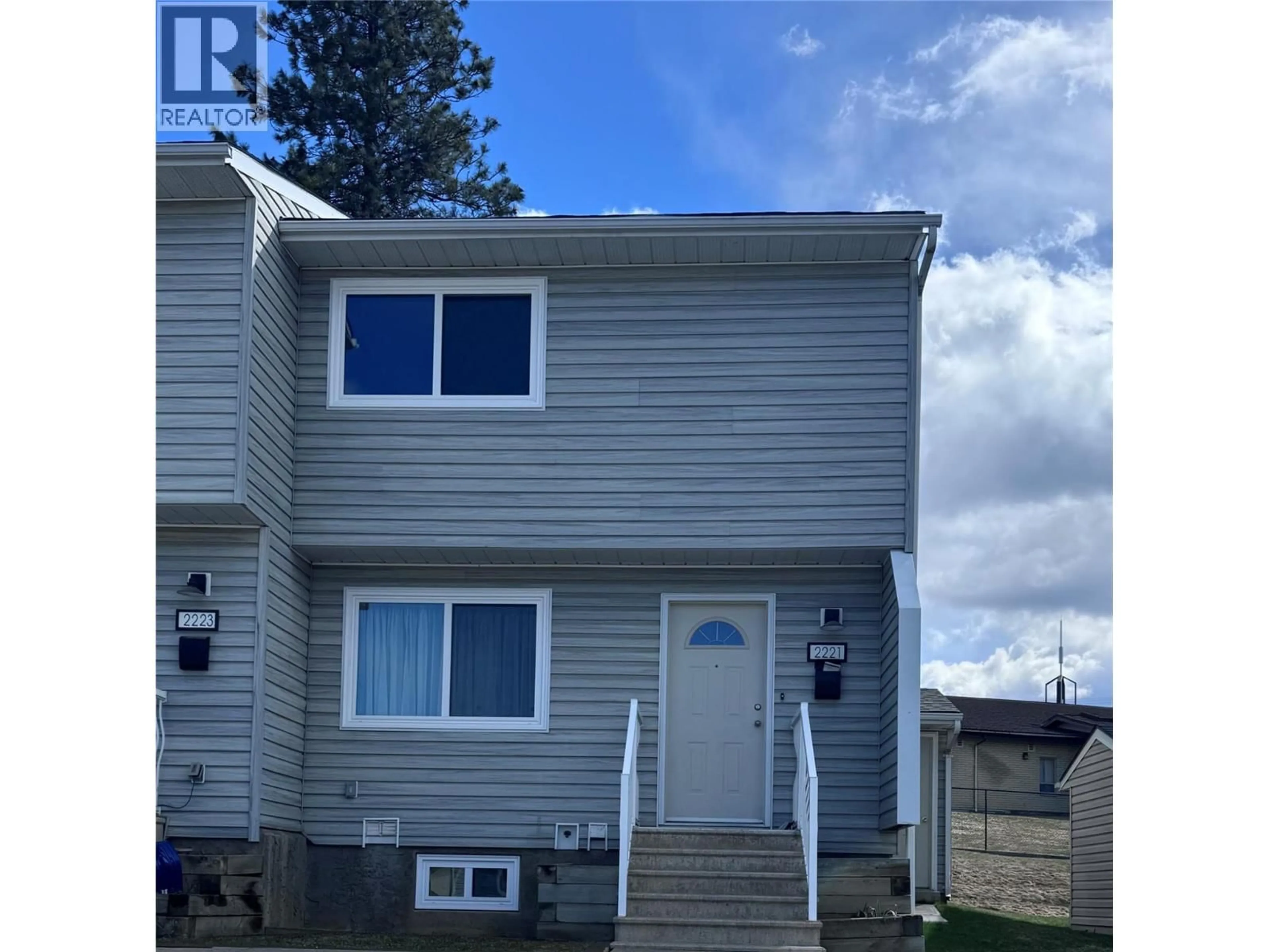 Home with vinyl exterior material, street for 2221 3RD N STREET, Cranbrook British Columbia V1C5G7