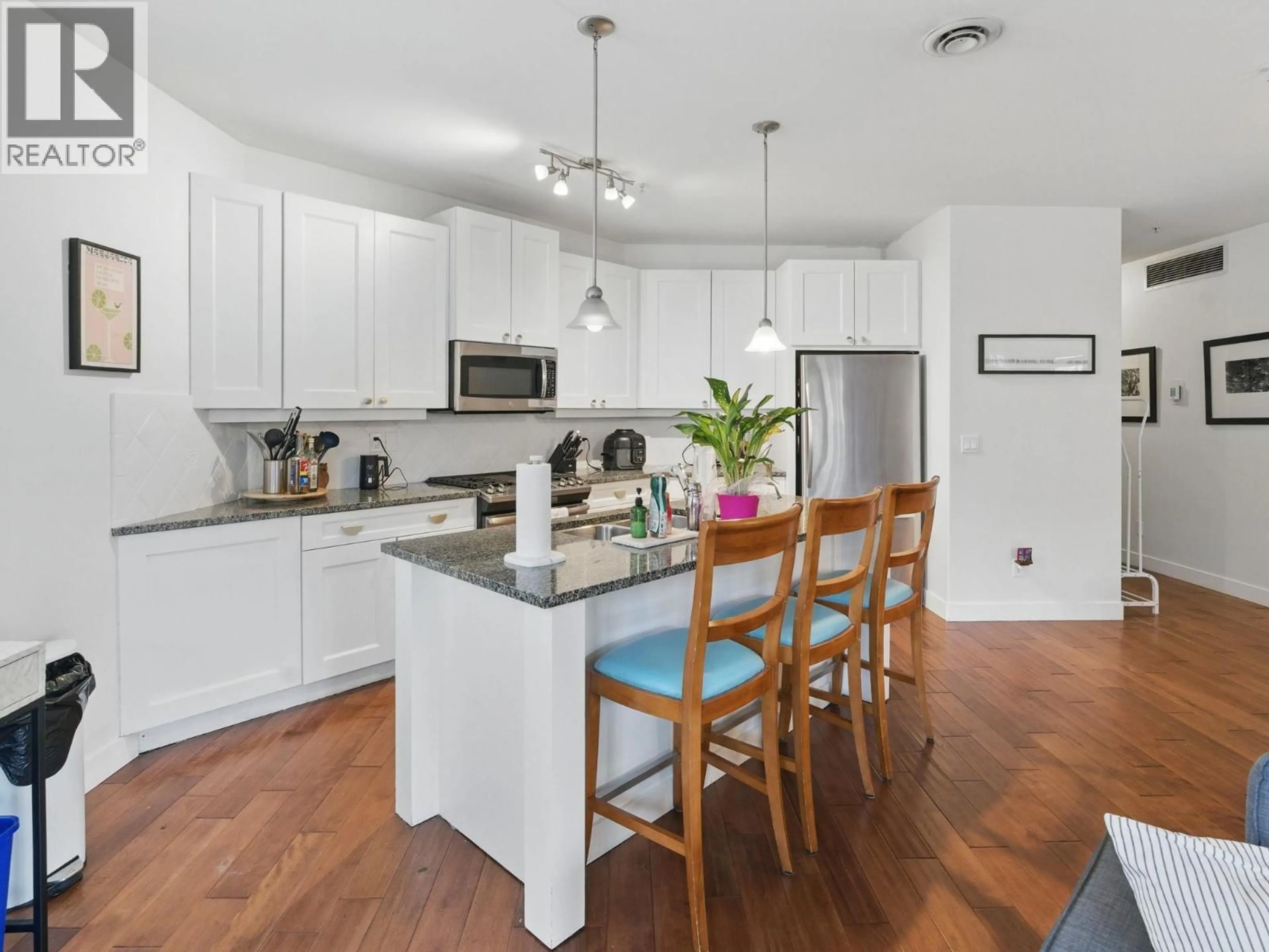 Open concept kitchen, wood/laminate floor for 6104 - 4026 PRITCHARD DRIVE NORTH, West Kelowna British Columbia V4T3E4