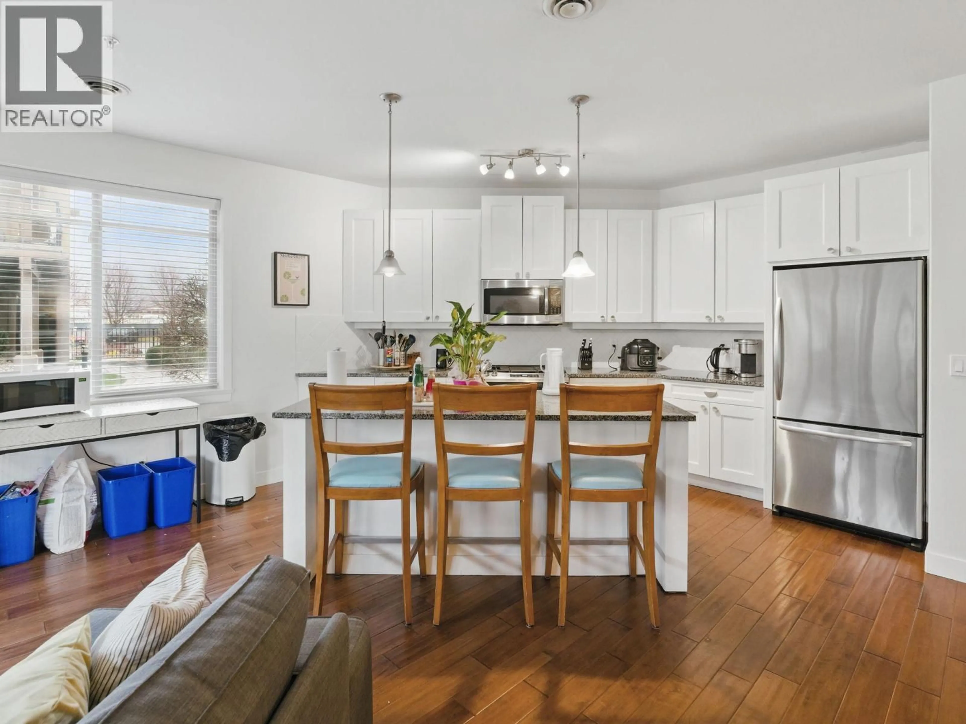 Open concept kitchen, wood/laminate floor for 6104 - 4026 PRITCHARD DRIVE NORTH, West Kelowna British Columbia V4T3E4