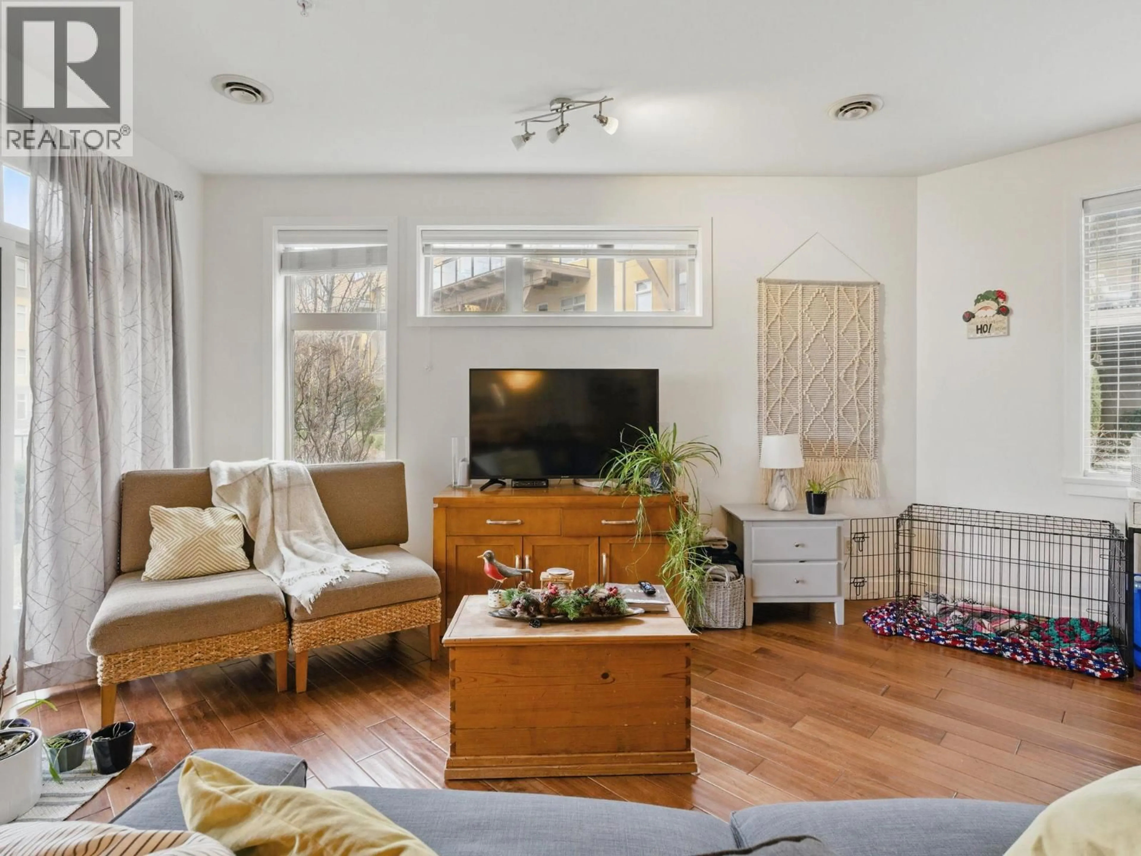 Living room with furniture, wood/laminate floor for 6104 - 4026 PRITCHARD DRIVE NORTH, West Kelowna British Columbia V4T3E4