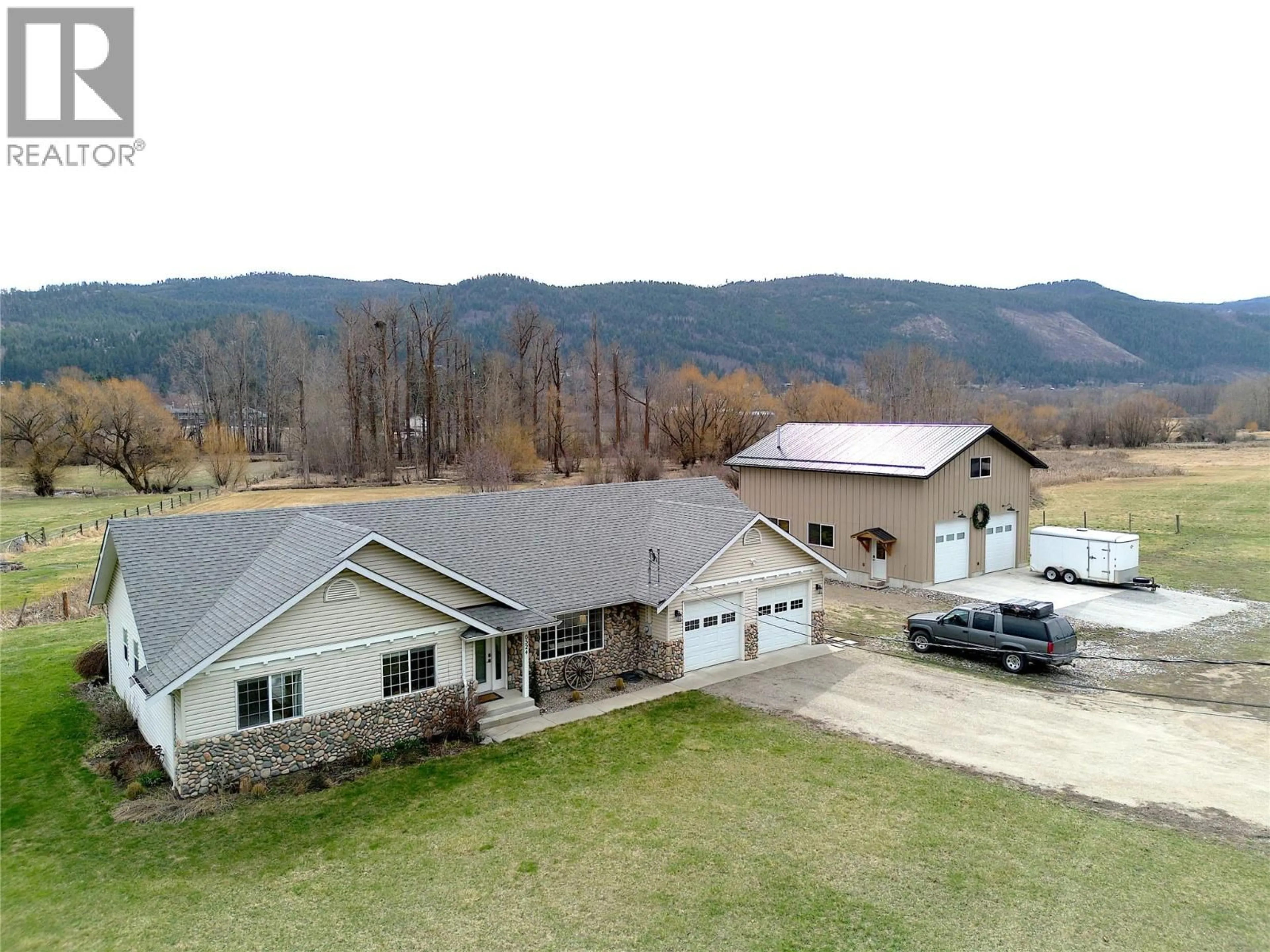 A pic from outside/outdoor area/front of a property/back of a property/a pic from drone, mountain view for 6524 HIGHWAY 6 OTHER, Coldstream British Columbia V1B3C6
