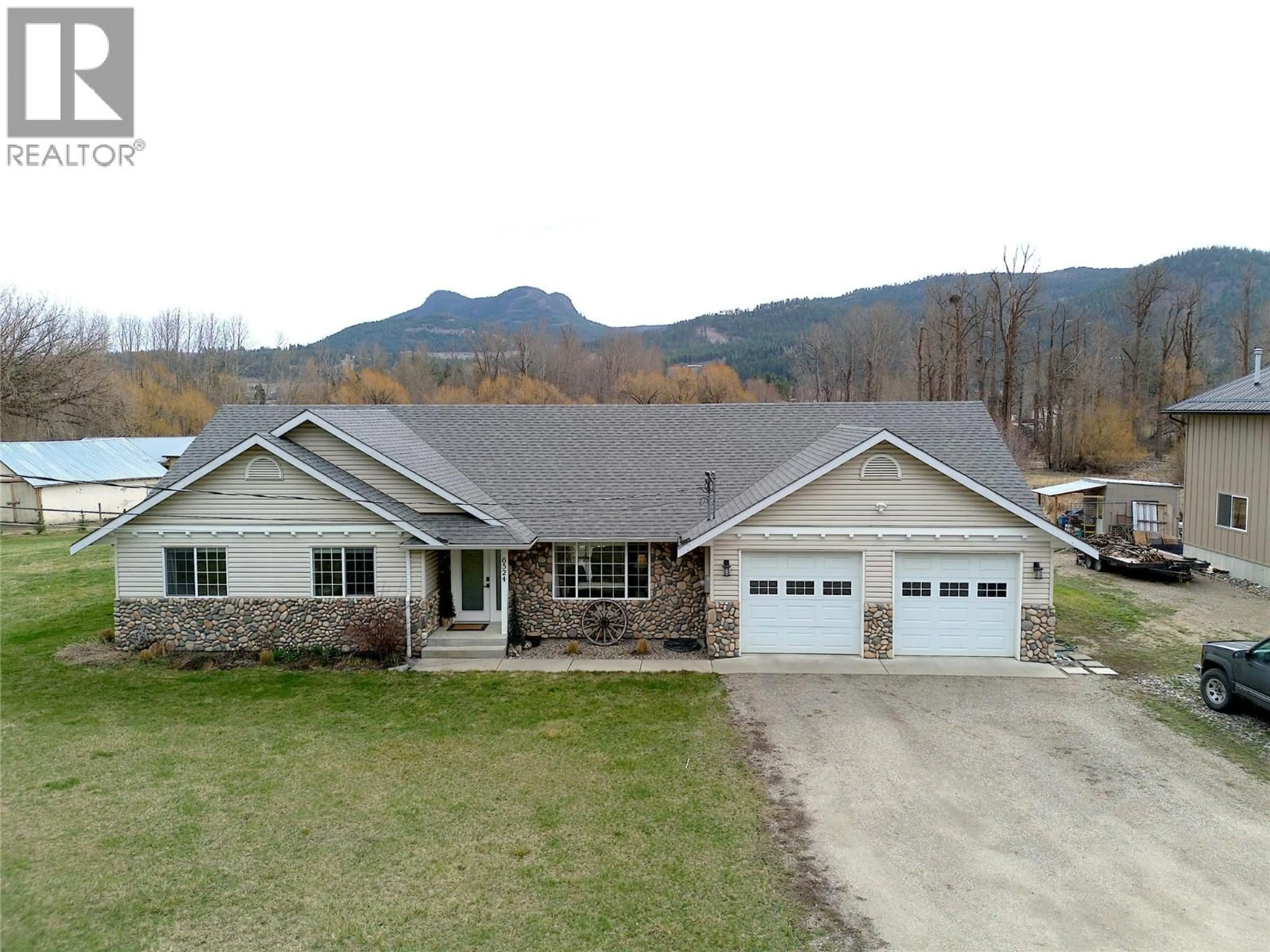 A pic from outside/outdoor area/front of a property/back of a property/a pic from drone, mountain view for 6524 HIGHWAY 6 OTHER, Coldstream British Columbia V1B3C6