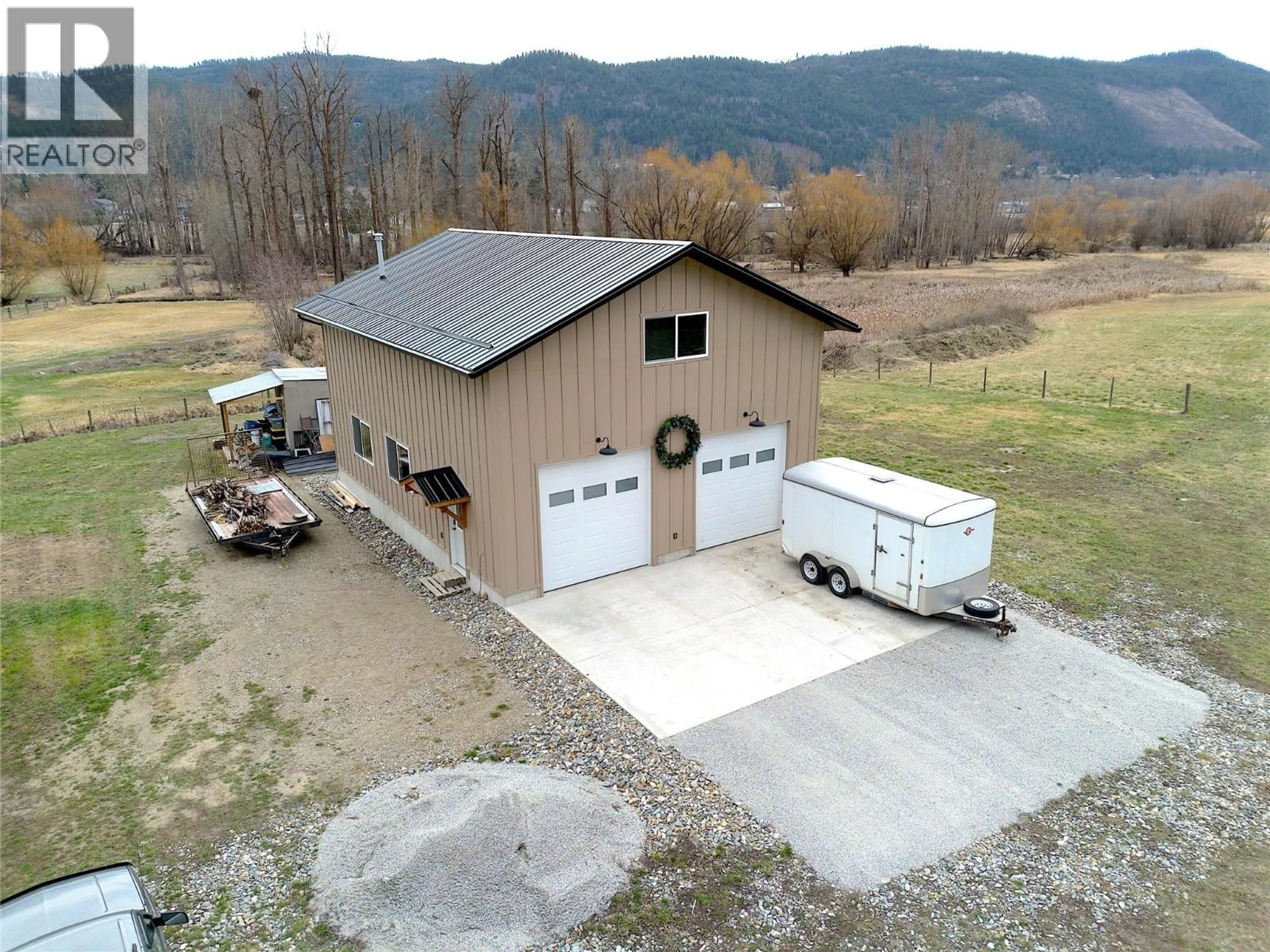A pic from outside/outdoor area/front of a property/back of a property/a pic from drone, building for 6524 HIGHWAY 6 OTHER, Coldstream British Columbia V1B3C6