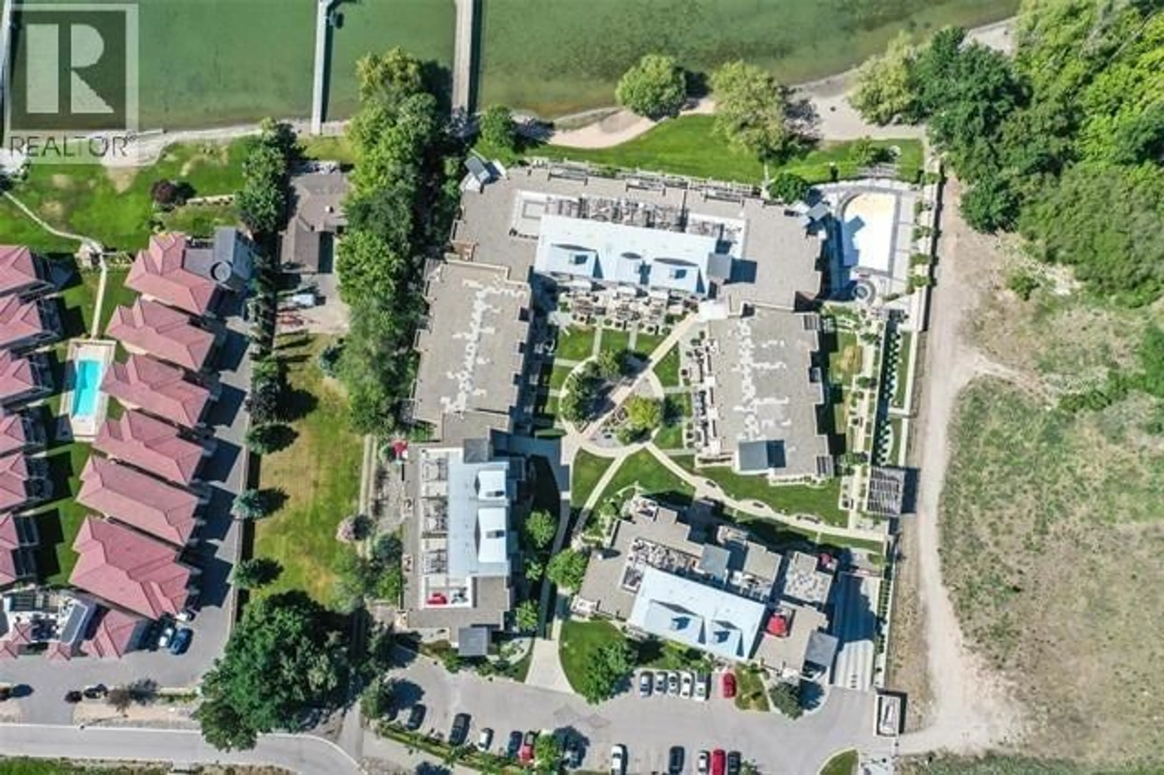 A pic from outside/outdoor area/front of a property/back of a property/a pic from drone, street for 1312 - 7343 OKANAGAN LANDING ROAD, Vernon British Columbia V1H2J6