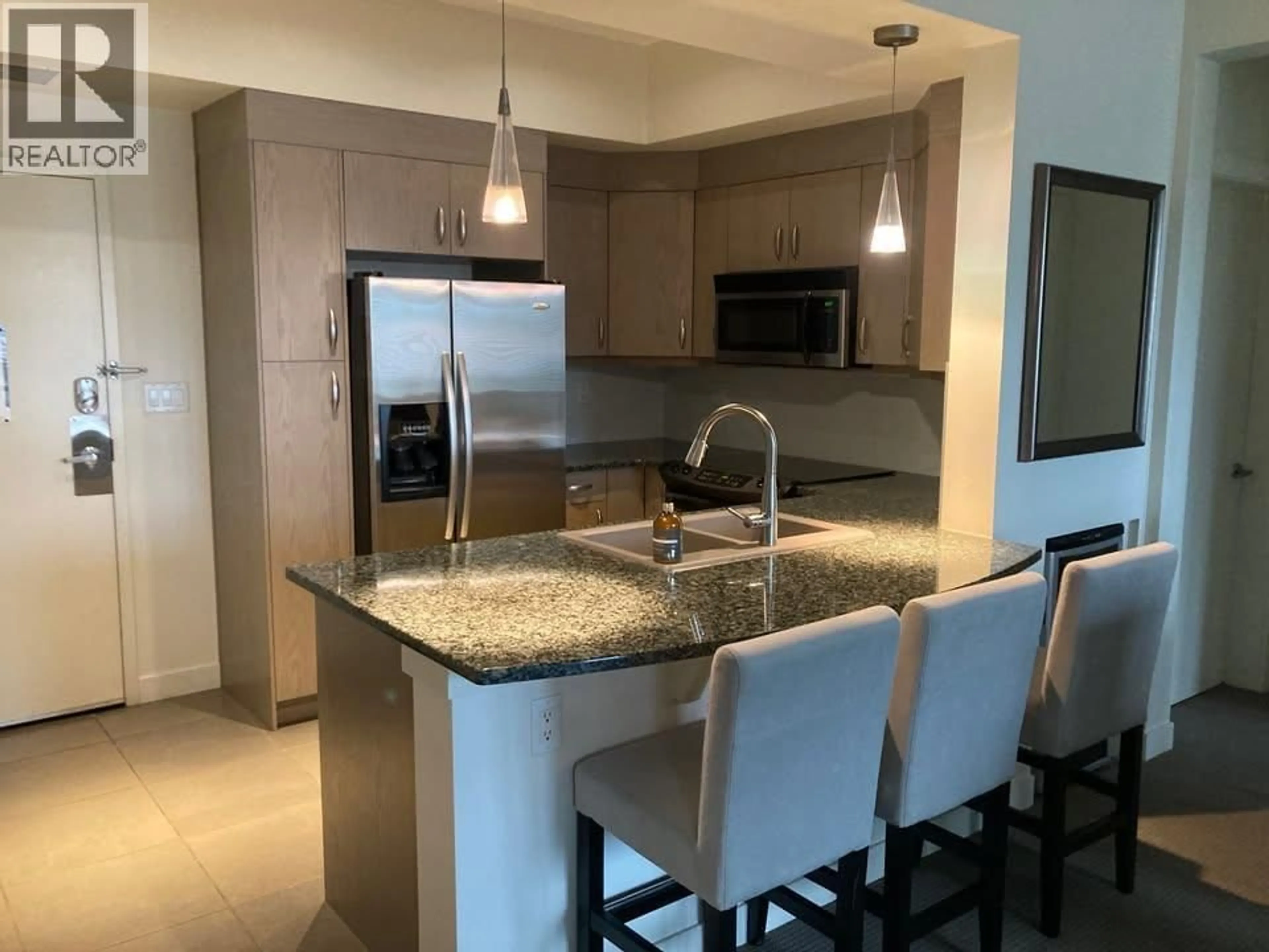 Open concept kitchen, ceramic/tile floor for 1312 - 7343 OKANAGAN LANDING ROAD, Vernon British Columbia V1H2J6