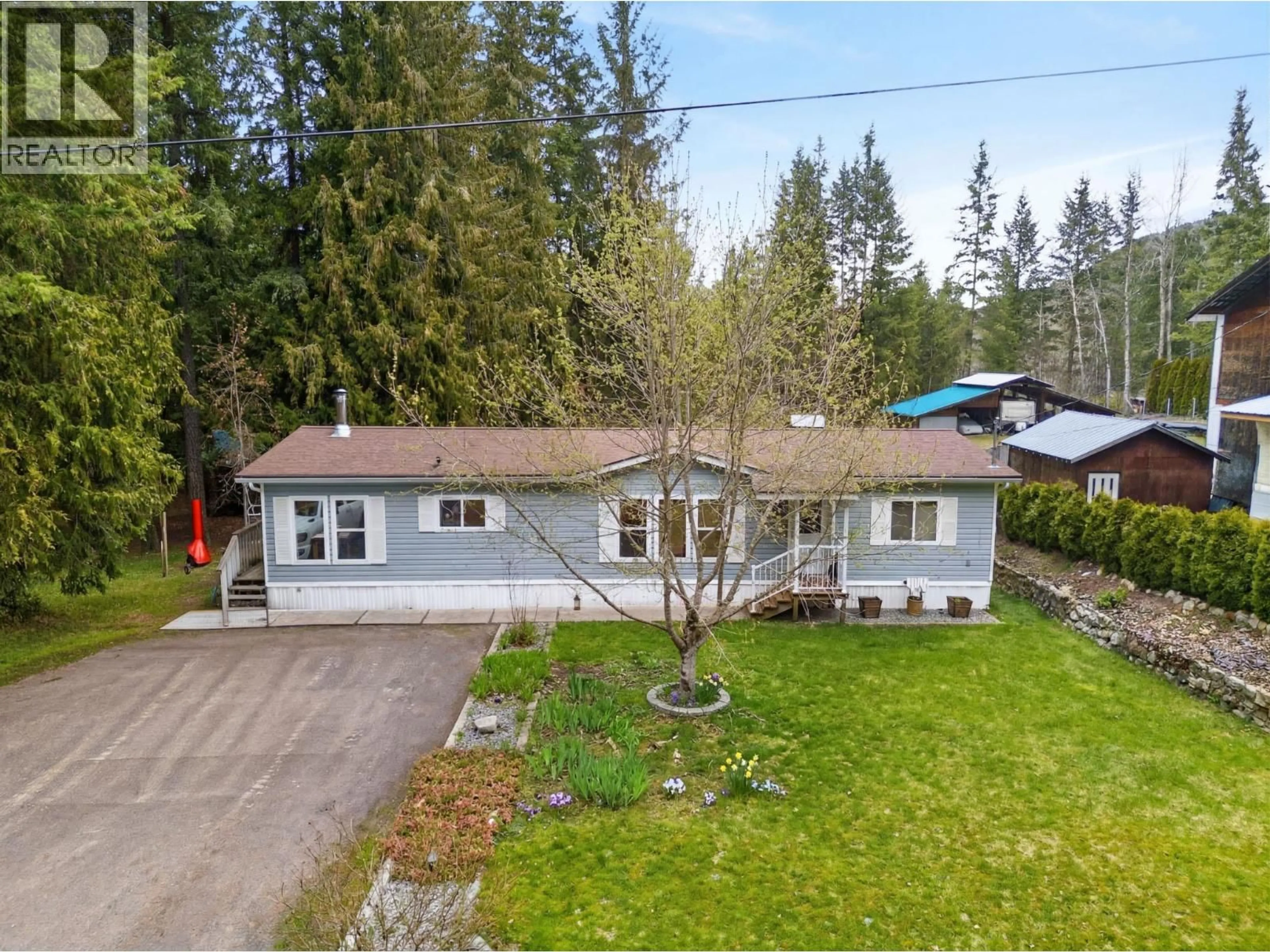 A pic from outside/outdoor area/front of a property/back of a property/a pic from drone, street for 19 WEST POIRIER ROAD, Mara British Columbia V0E2K0