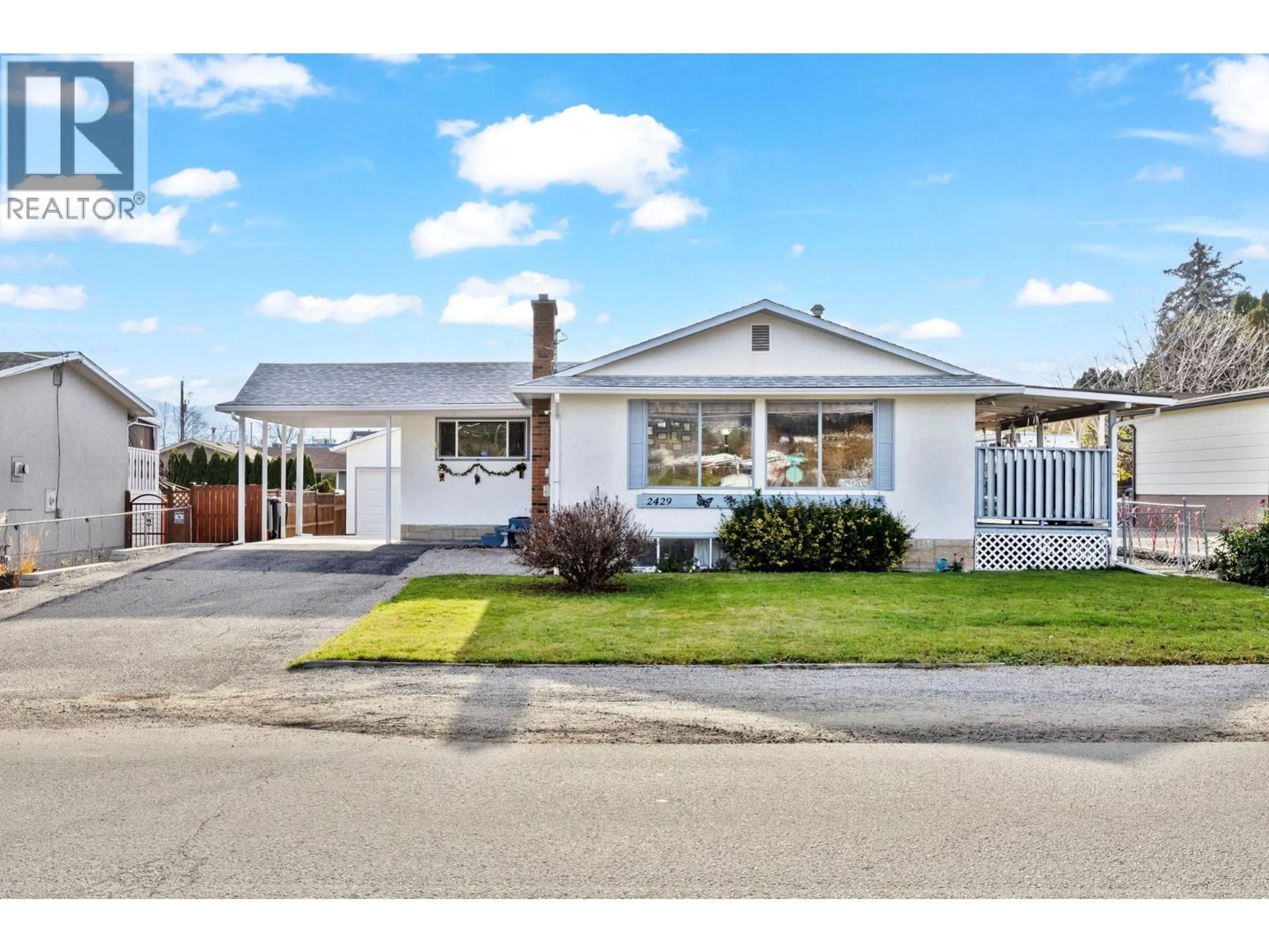 Home with vinyl exterior material, street for 2429 GOSSET ROAD, West Kelowna British Columbia V4T1P4