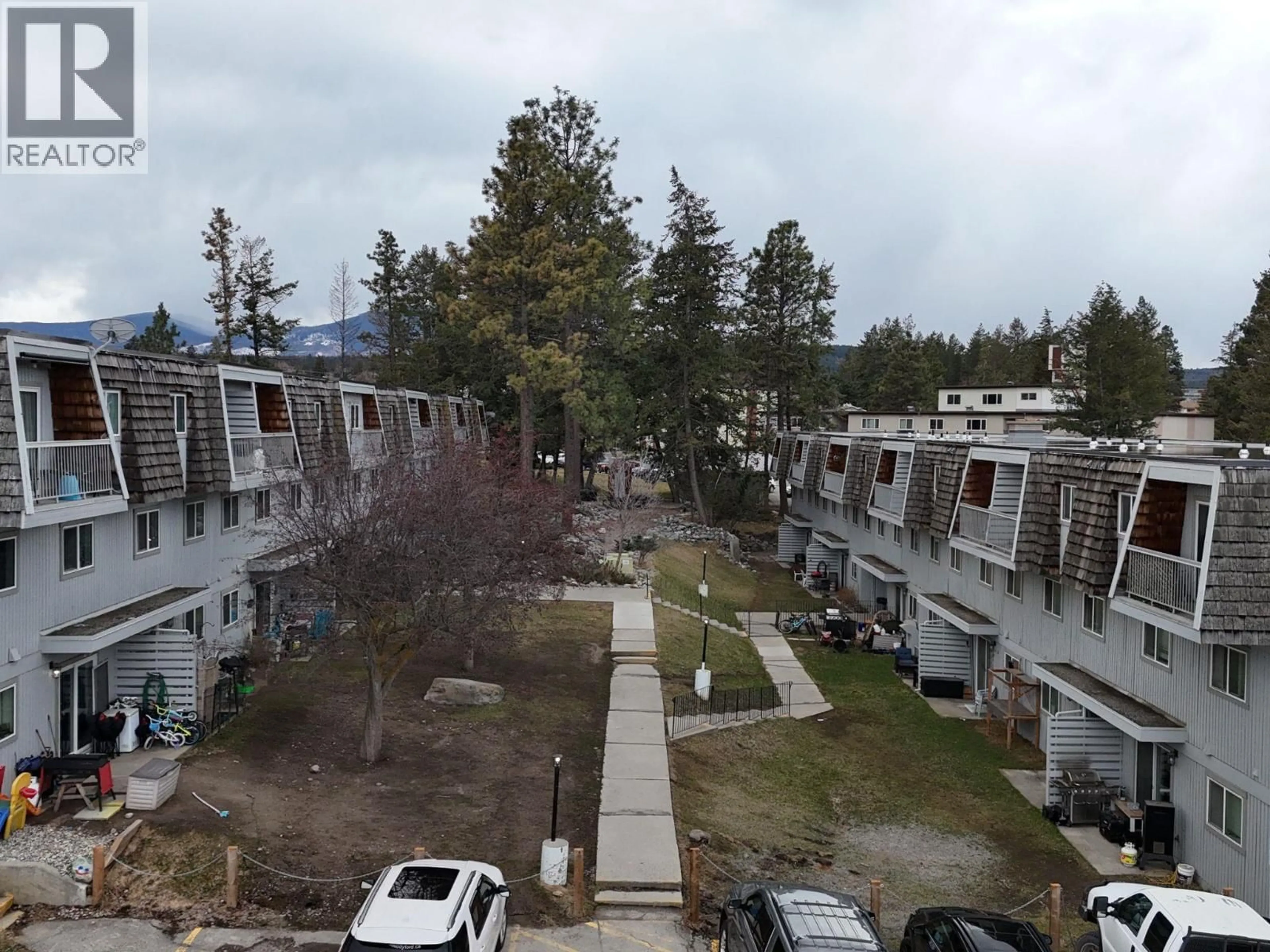 A pic from outside/outdoor area/front of a property/back of a property/a pic from drone, mountain view for 206 - 2117 2ND STREET NORTH, Cranbrook British Columbia V1C3L4