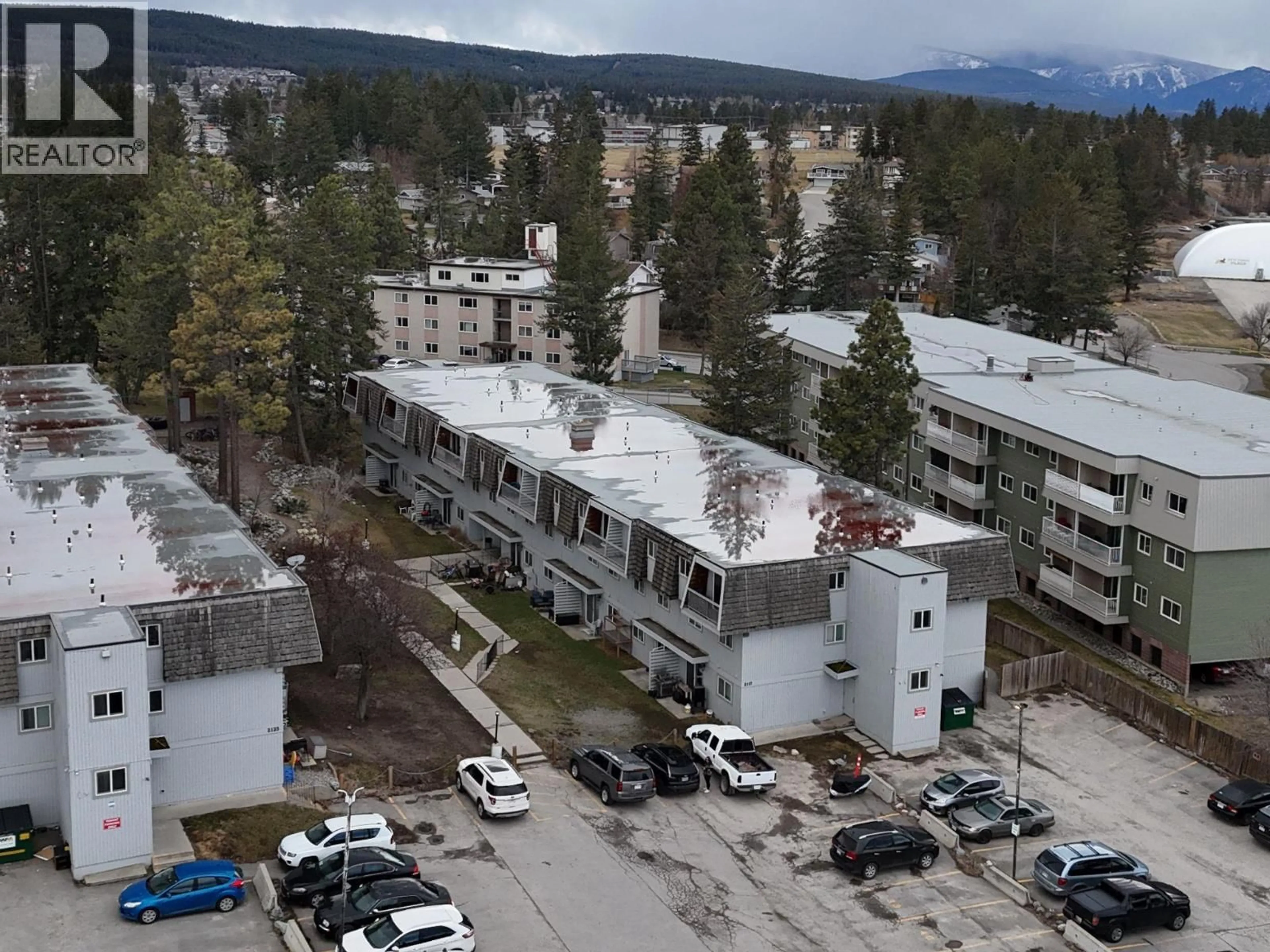 A pic from outside/outdoor area/front of a property/back of a property/a pic from drone, mountain view for 206 - 2117 2ND STREET NORTH, Cranbrook British Columbia V1C3L4