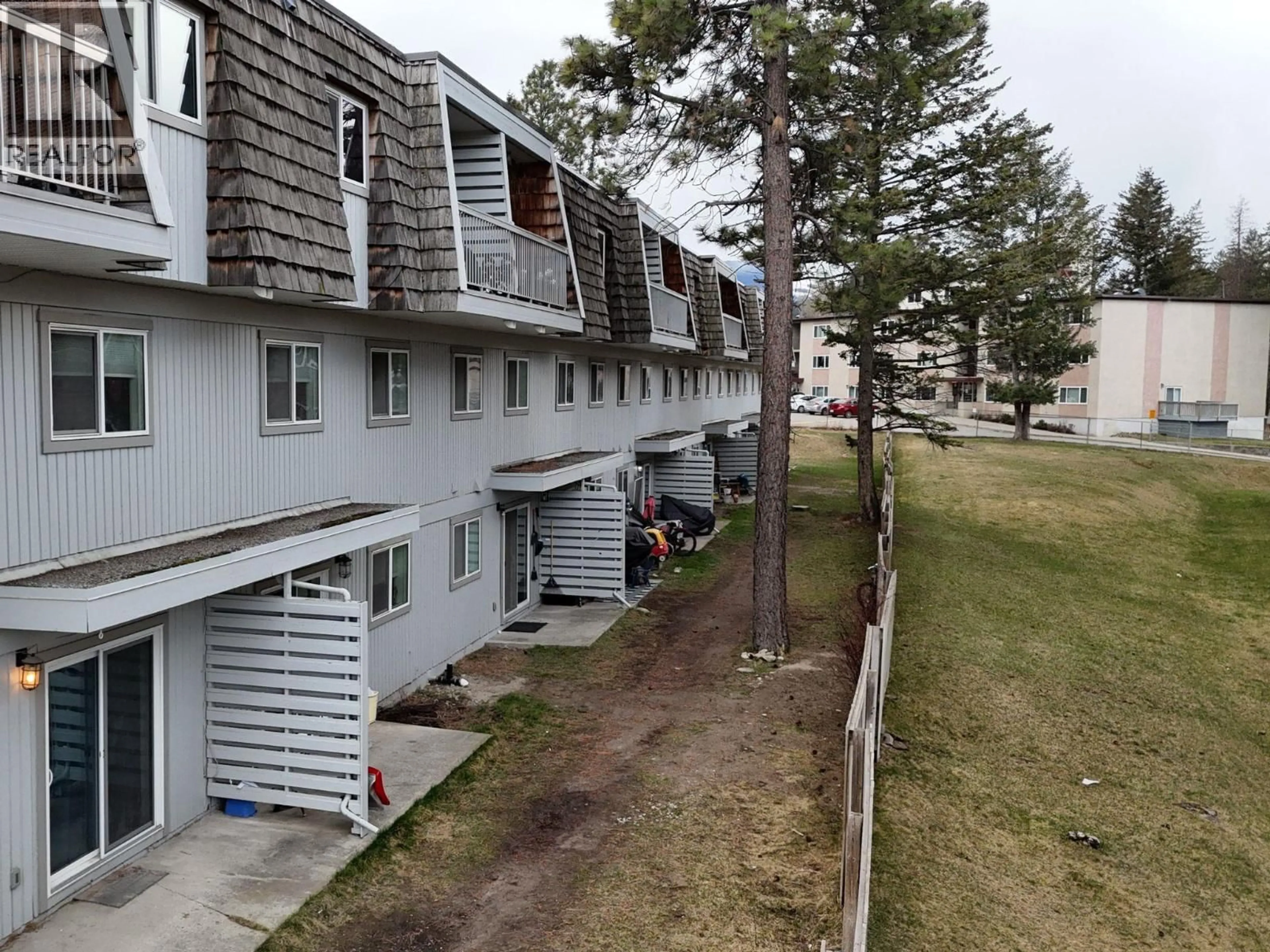 A pic from outside/outdoor area/front of a property/back of a property/a pic from drone, street for 206 - 2117 2ND STREET NORTH, Cranbrook British Columbia V1C3L4