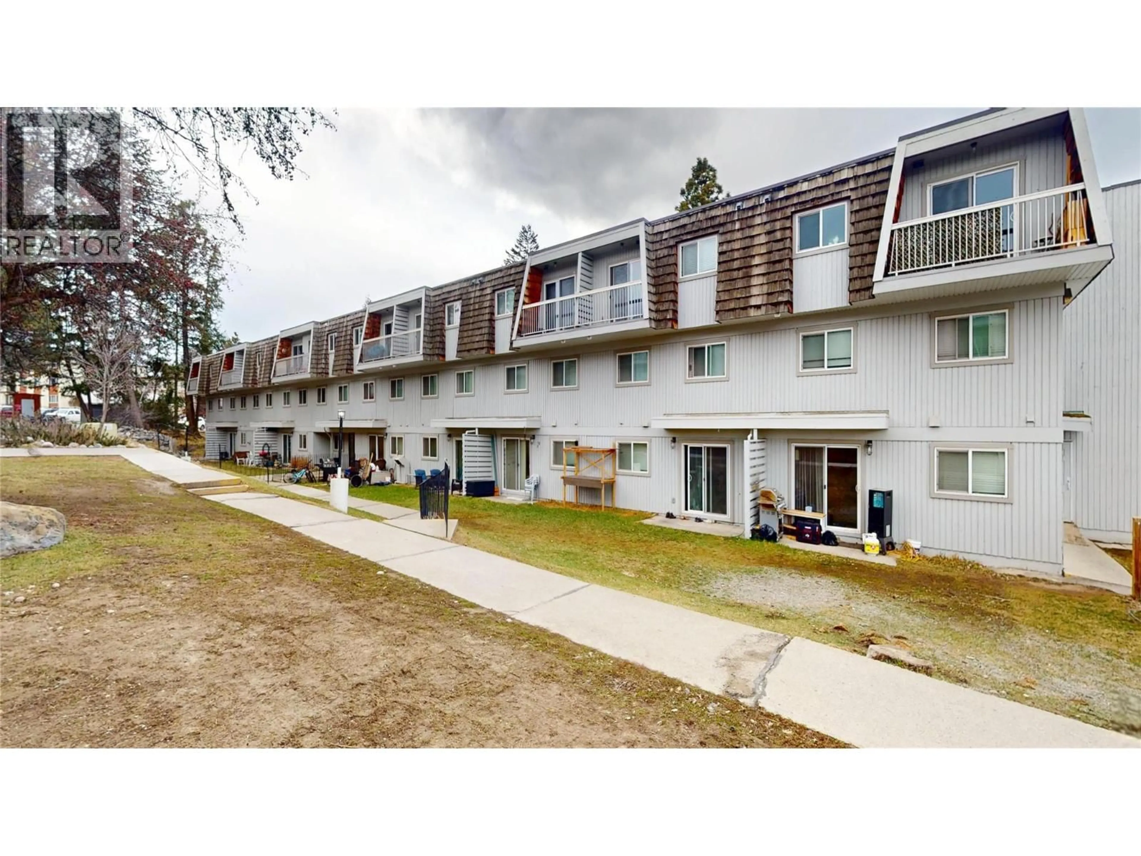 A pic from outside/outdoor area/front of a property/back of a property/a pic from drone, street for 206 - 2117 2ND STREET NORTH, Cranbrook British Columbia V1C3L4