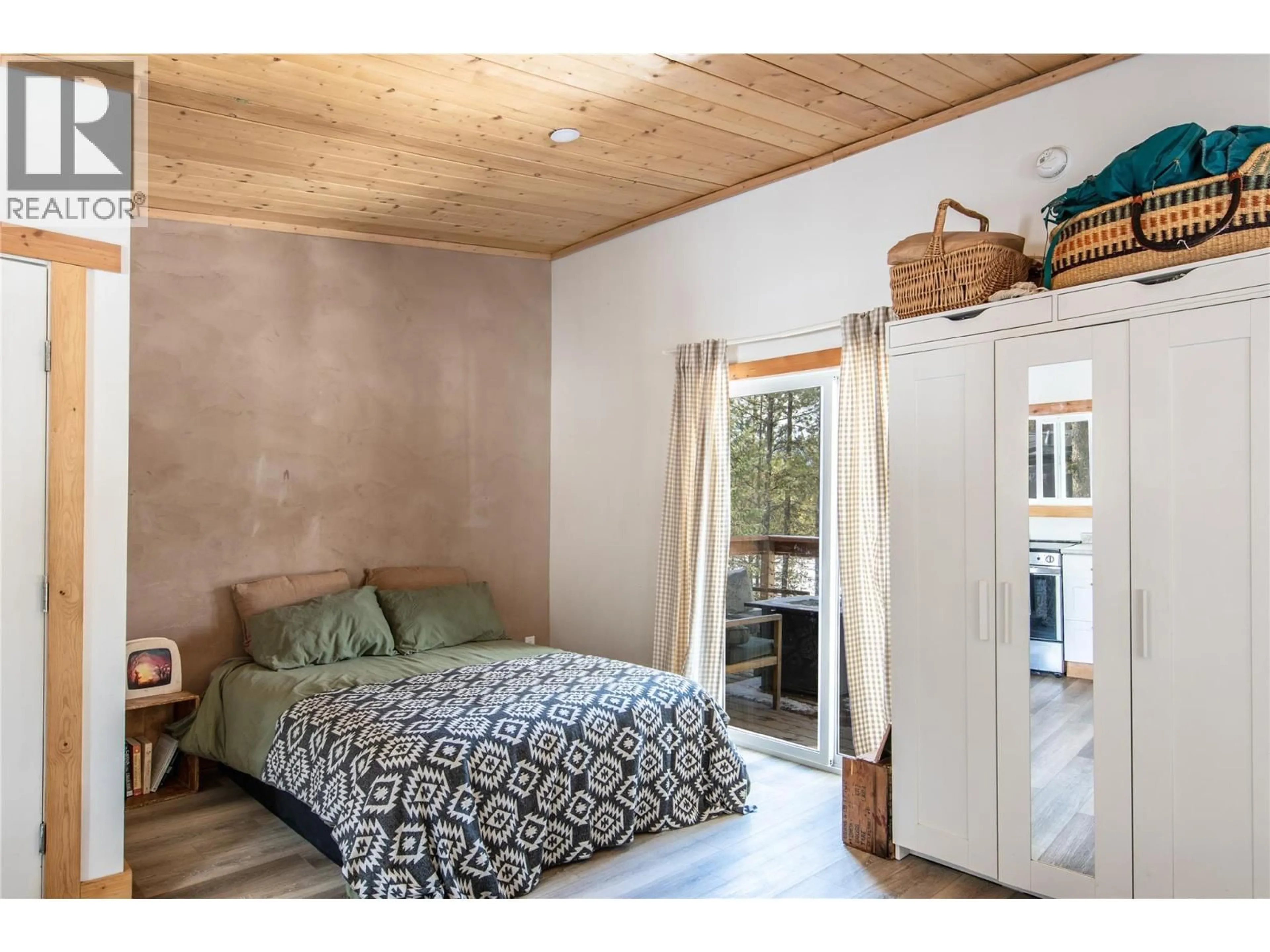 Bedroom with bed, wood/laminate floor for 2325 HEDGES ROAD, Golden British Columbia V0A1H1