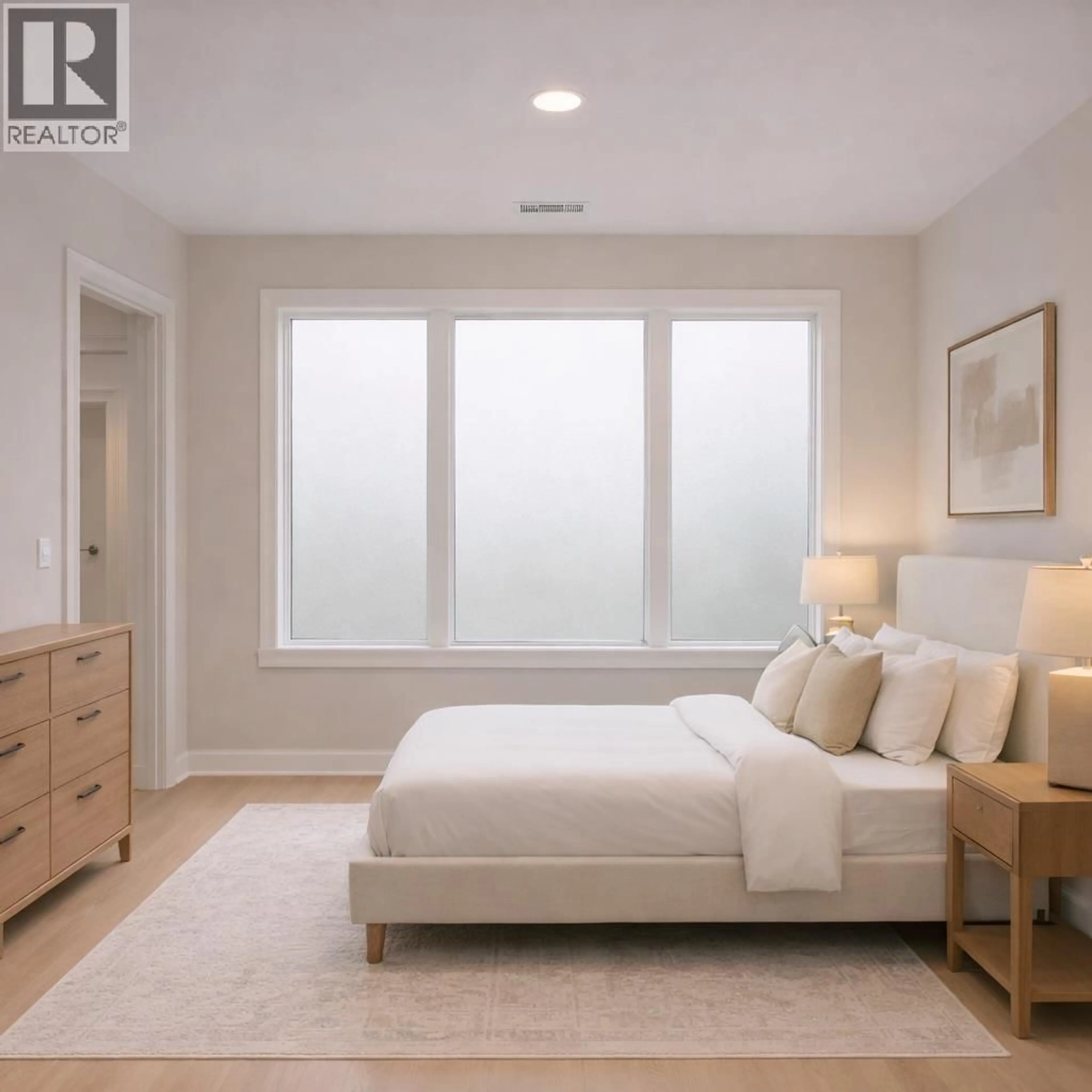 Bedroom with bed, wood/laminate floor for 912 BULL CRESCENT, Kelowna British Columbia V1W4N2