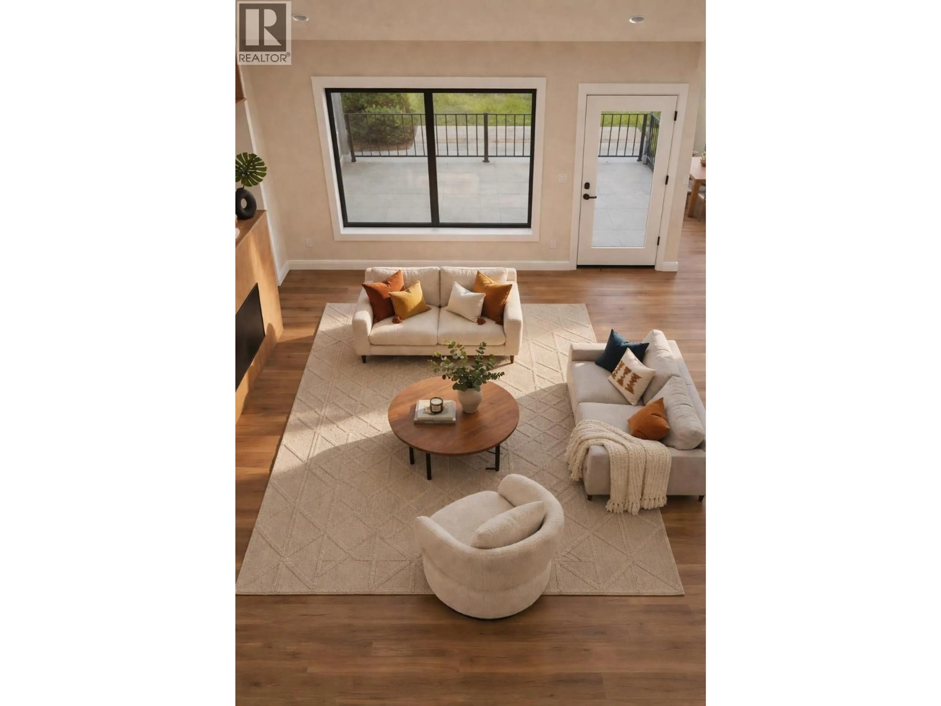 Living room with furniture, wood/laminate floor for 912 BULL CRESCENT, Kelowna British Columbia V1W4N2