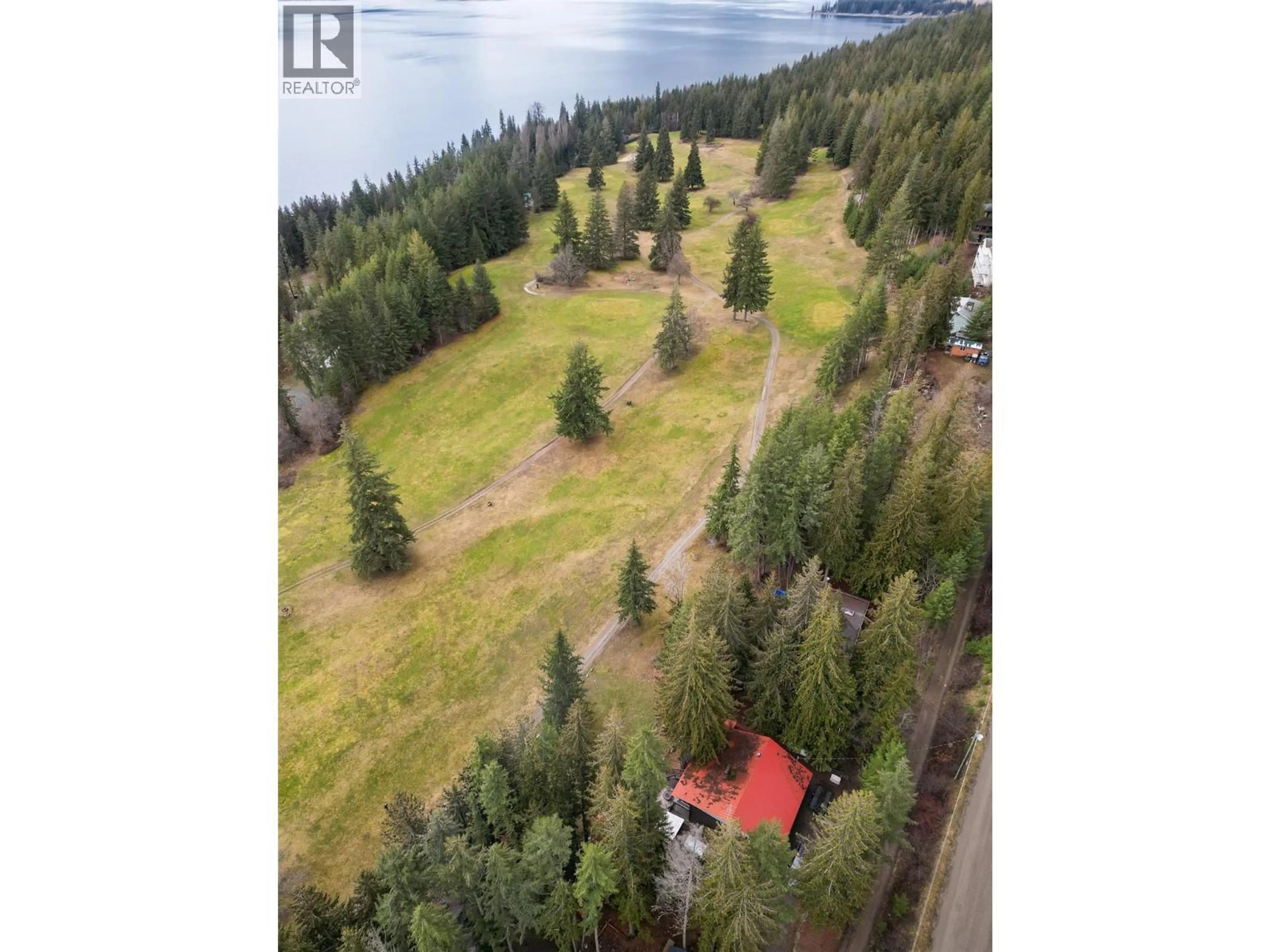 A pic from outside/outdoor area/front of a property/back of a property/a pic from drone, water/lake/river/ocean view for 7796 COLUMBIA DRIVE, Anglemont British Columbia V0E1M8