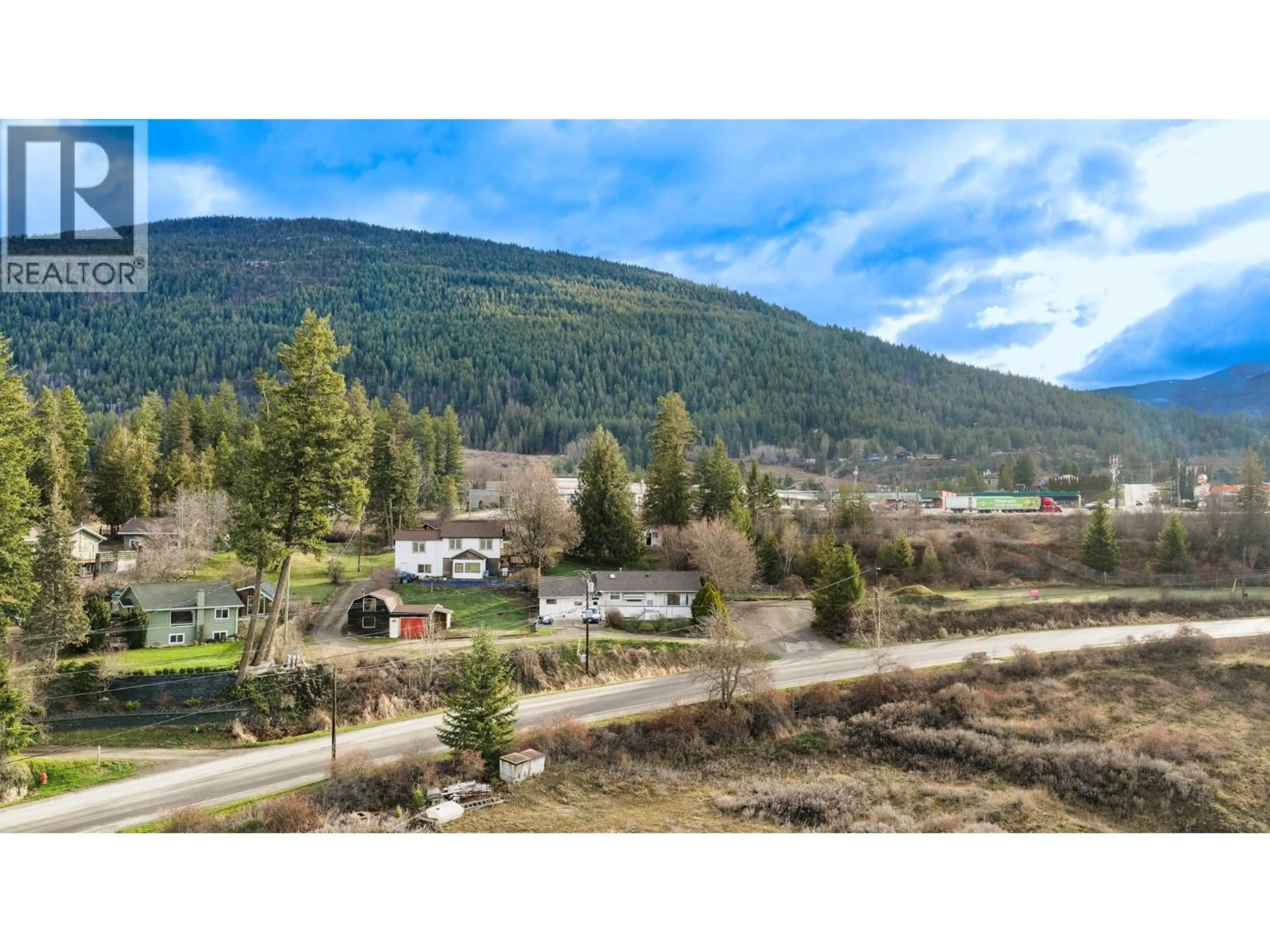 A pic from outside/outdoor area/front of a property/back of a property/a pic from drone, mountain view for 338 VALLEYVIEW DRIVE, Creston British Columbia V0B1G3