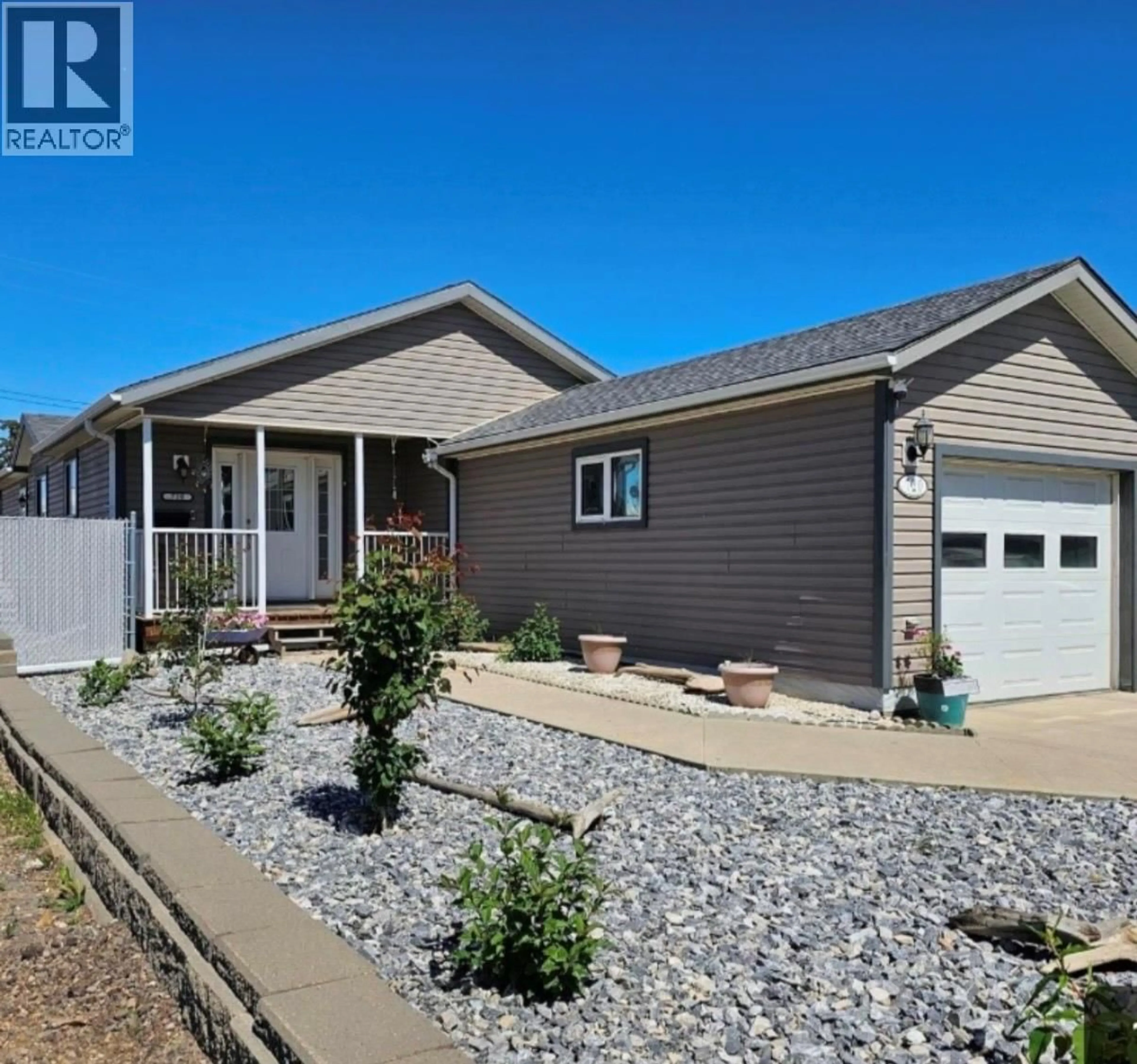 Home with vinyl exterior material, street for 720 105 AVENUE, Dawson Creek British Columbia V1G2K6