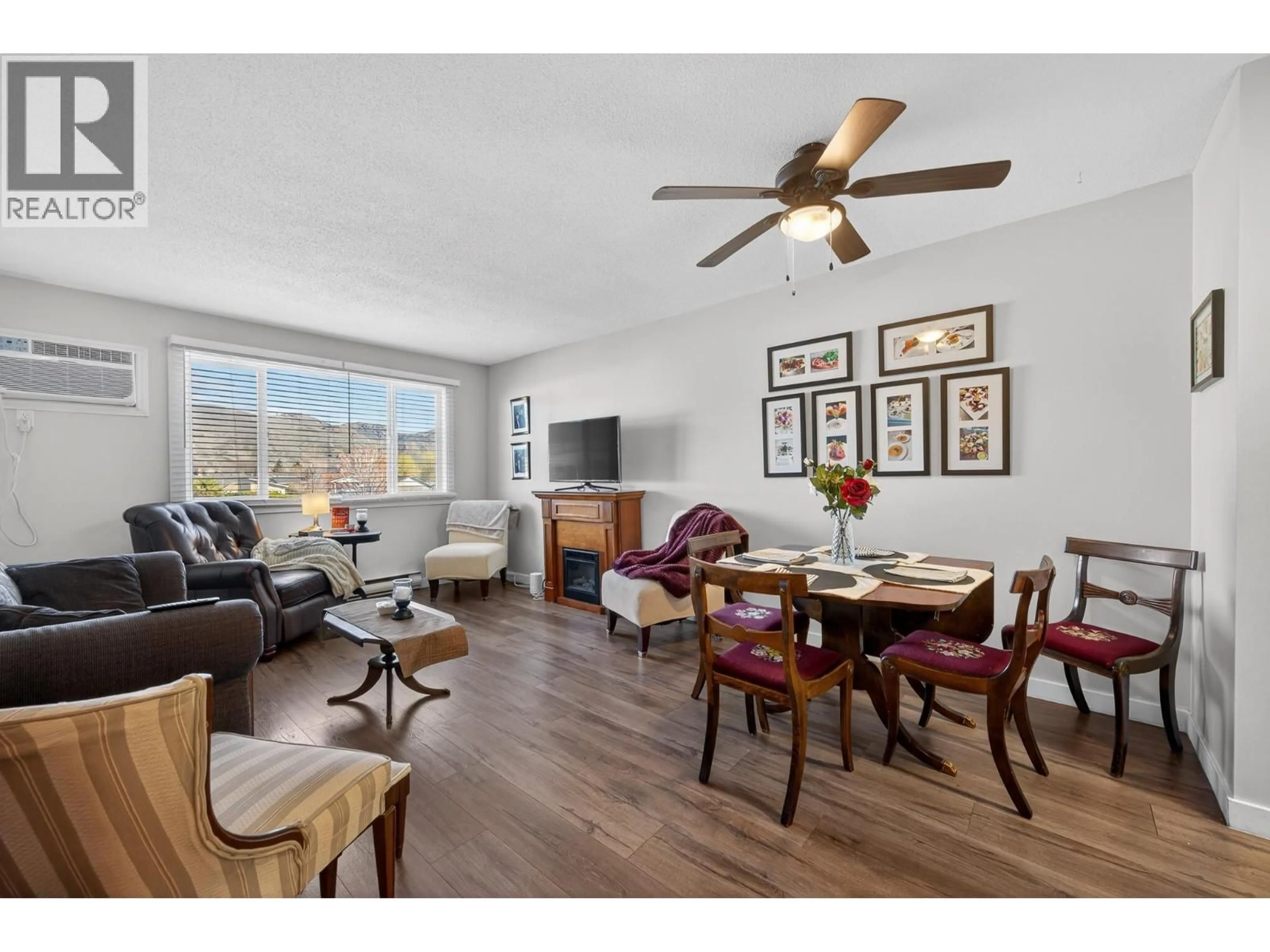 Living room with furniture, wood/laminate floor for 331 - 815 SOUTHILL STREET, Kamloops British Columbia V2B5L9