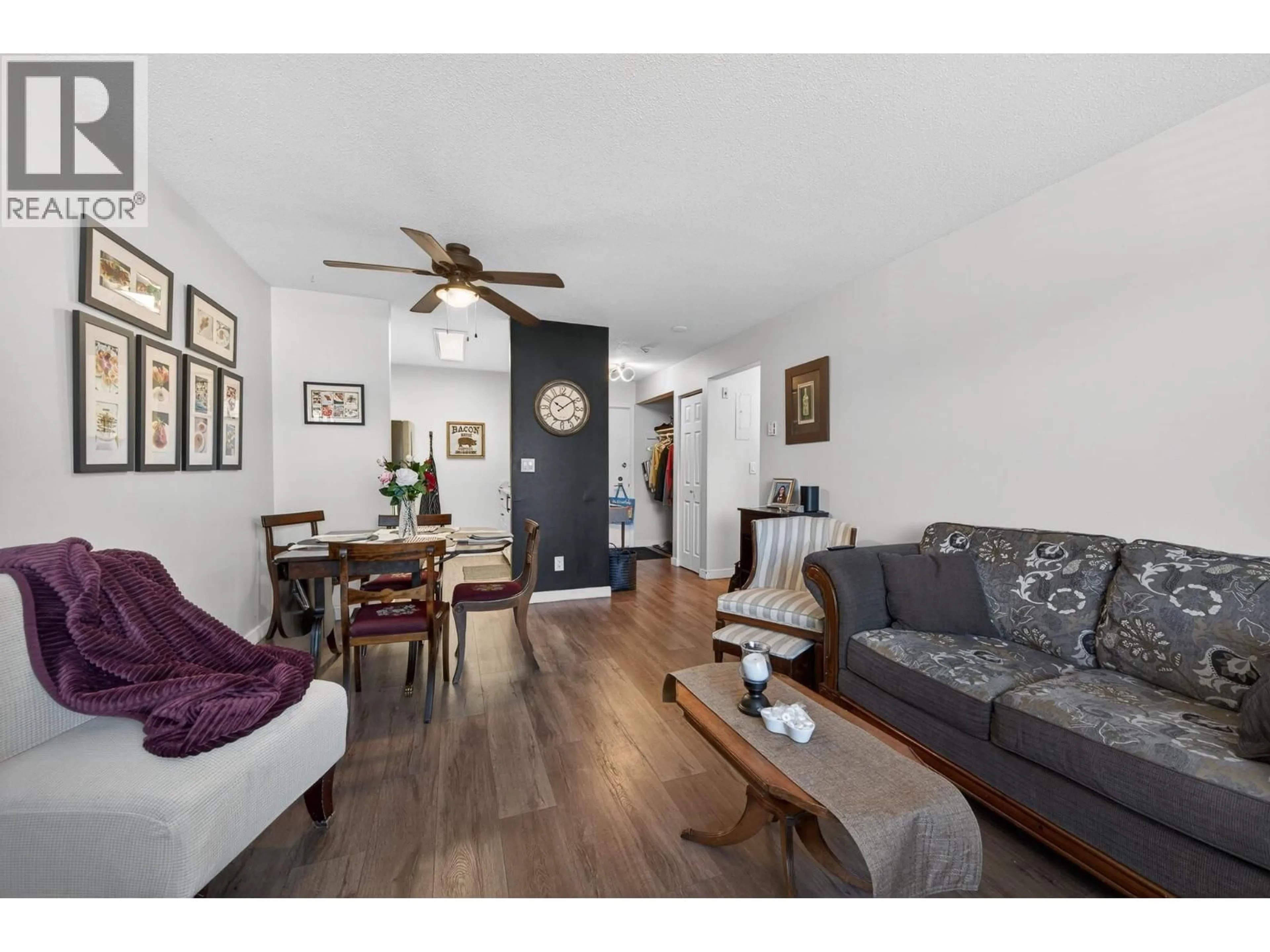 Living room with furniture, wood/laminate floor for 331 - 815 SOUTHILL STREET, Kamloops British Columbia V2B5L9