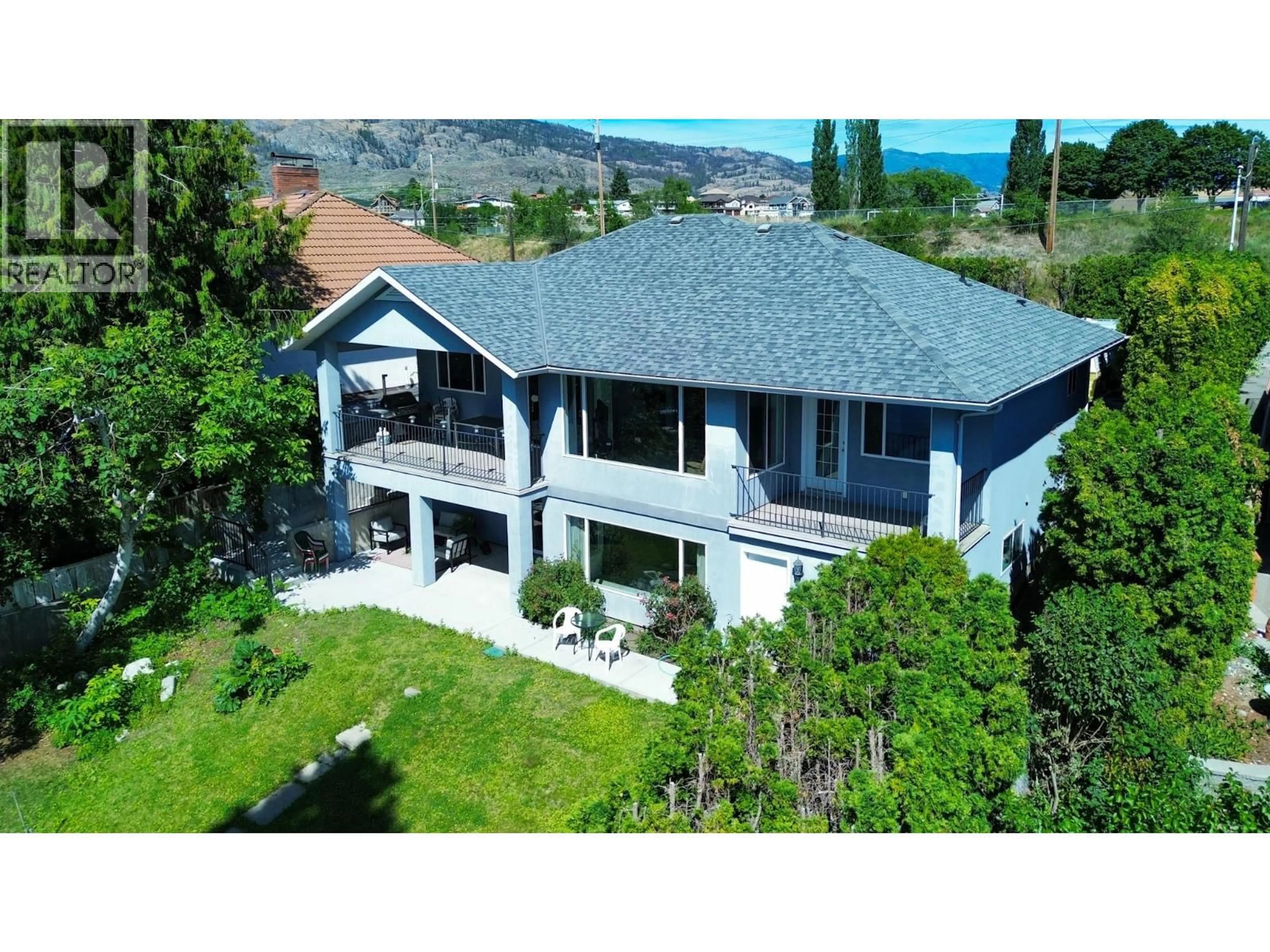 A pic from outside/outdoor area/front of a property/back of a property/a pic from drone, mountain view for 8503 KINGFISHER DRIVE, Osoyoos British Columbia V0H1V1