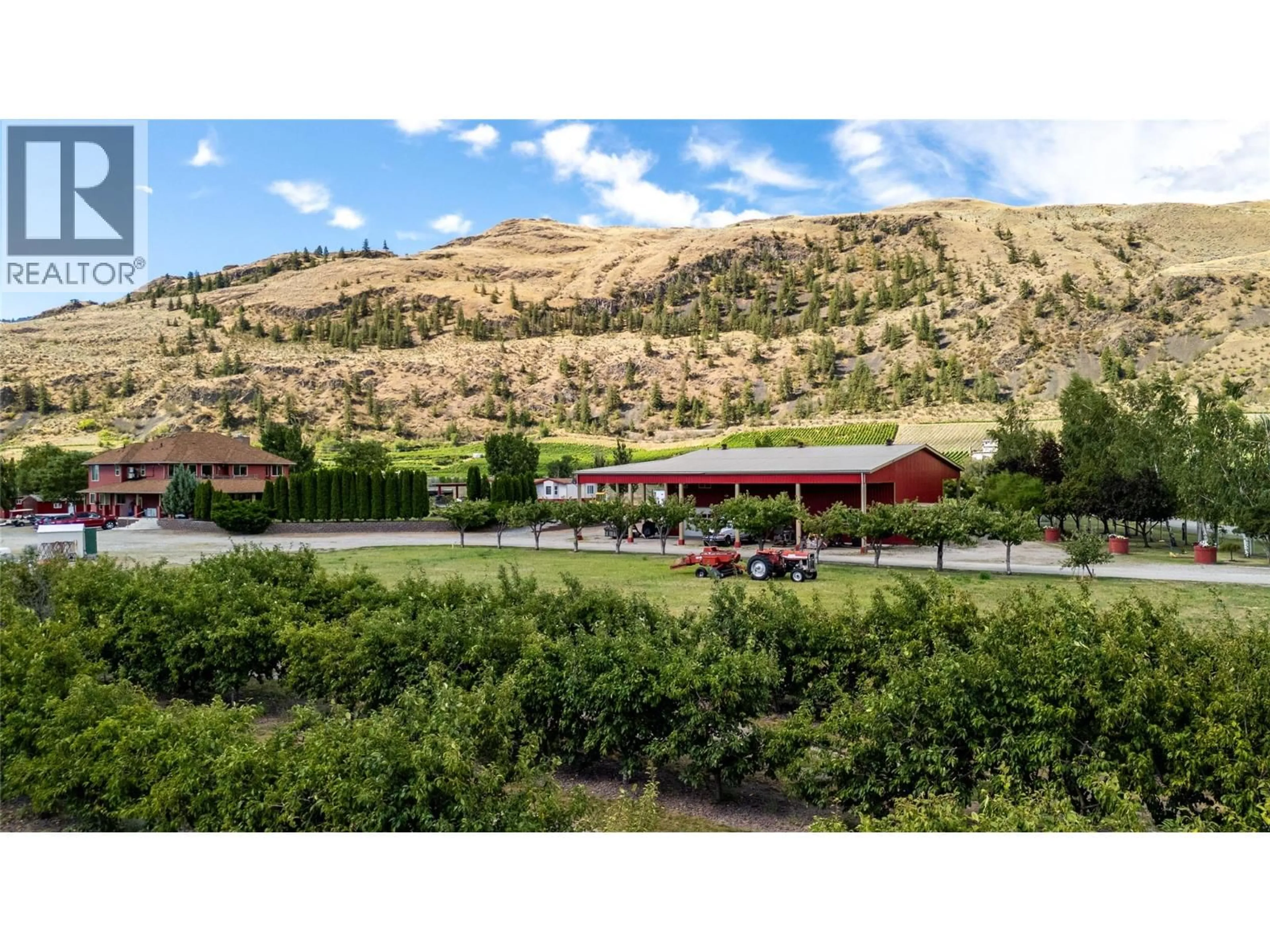 A pic from outside/outdoor area/front of a property/back of a property/a pic from drone, mountain view for 8705 ROAD 22 ROAD, Oliver British Columbia V0H1T1