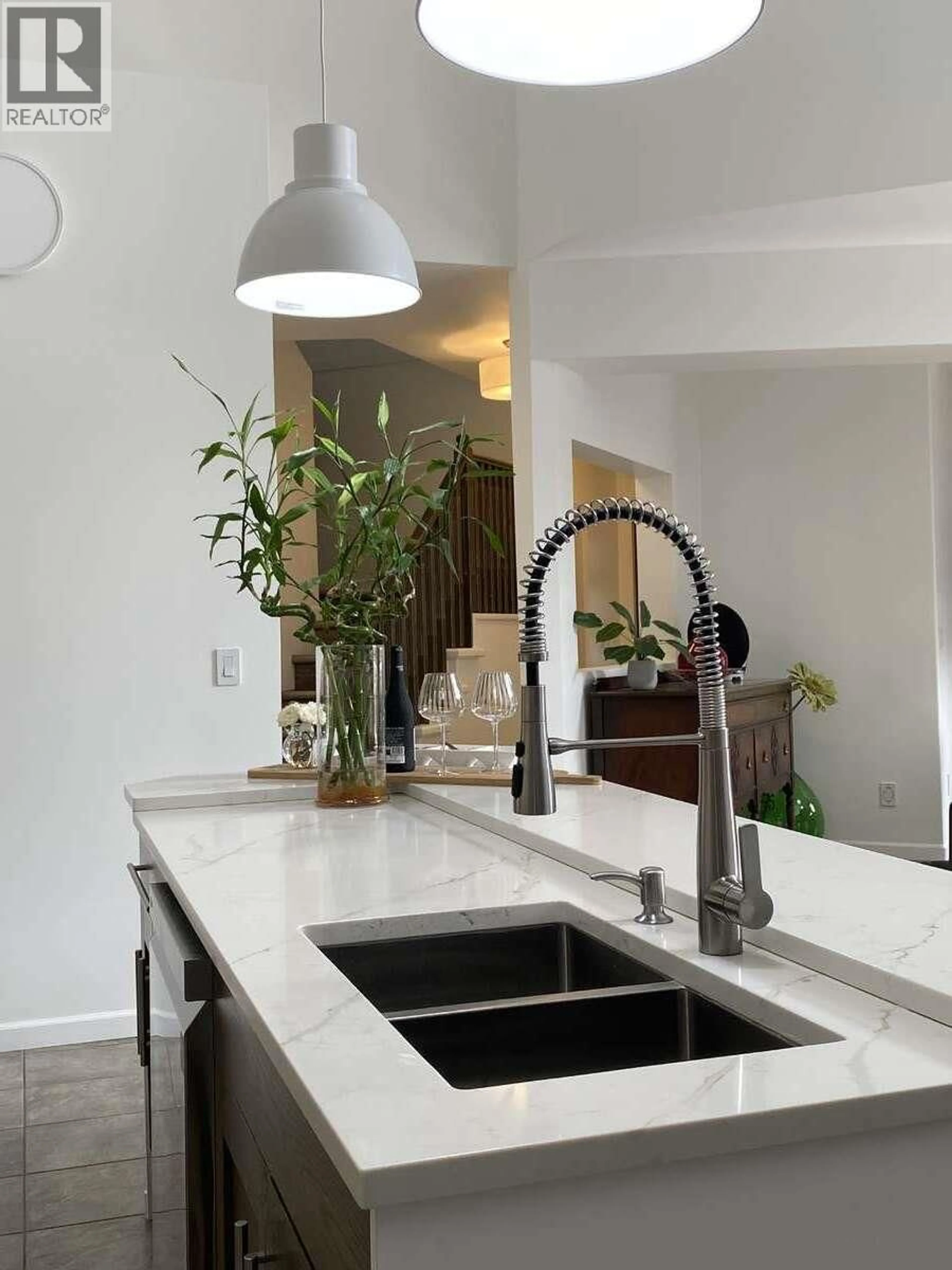 Contemporary kitchen, ceramic/tile floor for 307 - 1905 PANDOSY STREET, Kelowna British Columbia V1Y1R8