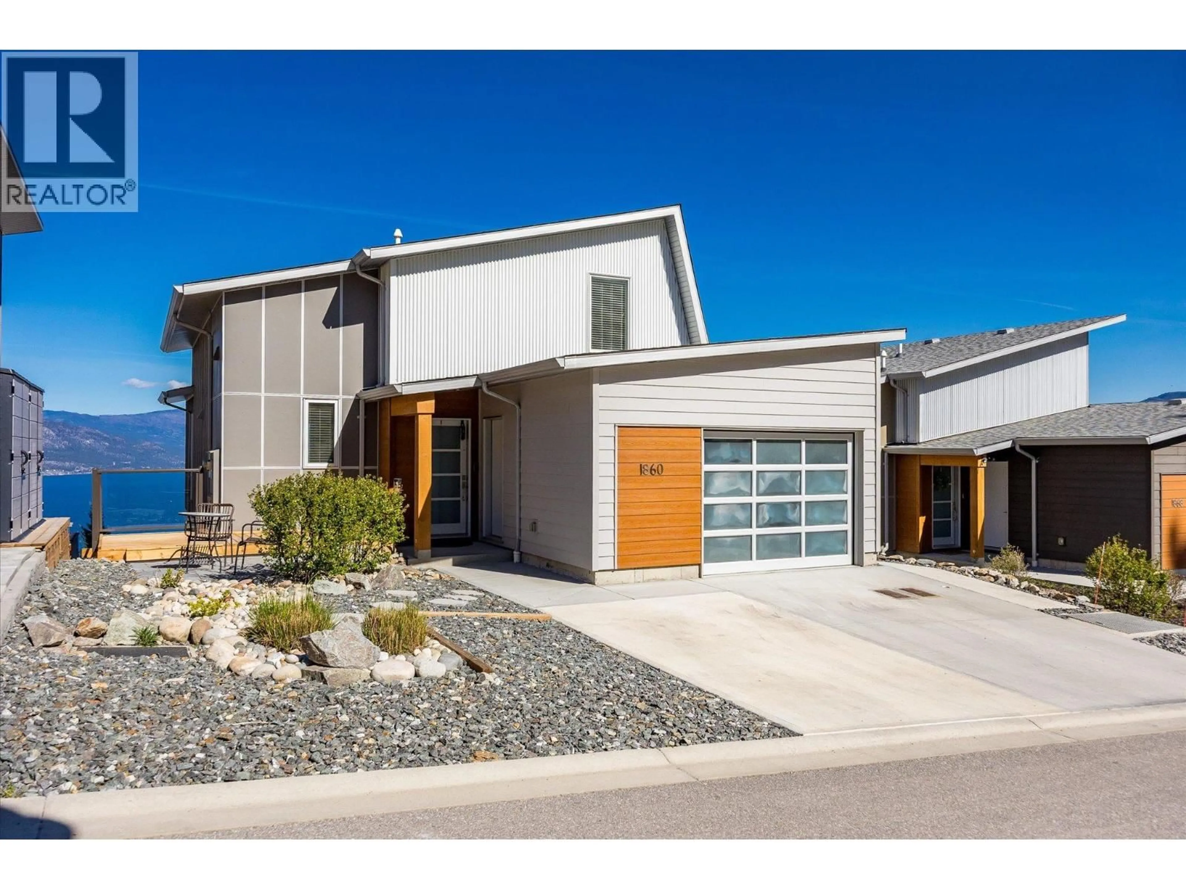 Home with vinyl exterior material, street for 1860 BLUE BUNCH COURT, Kelowna British Columbia V1V0C6