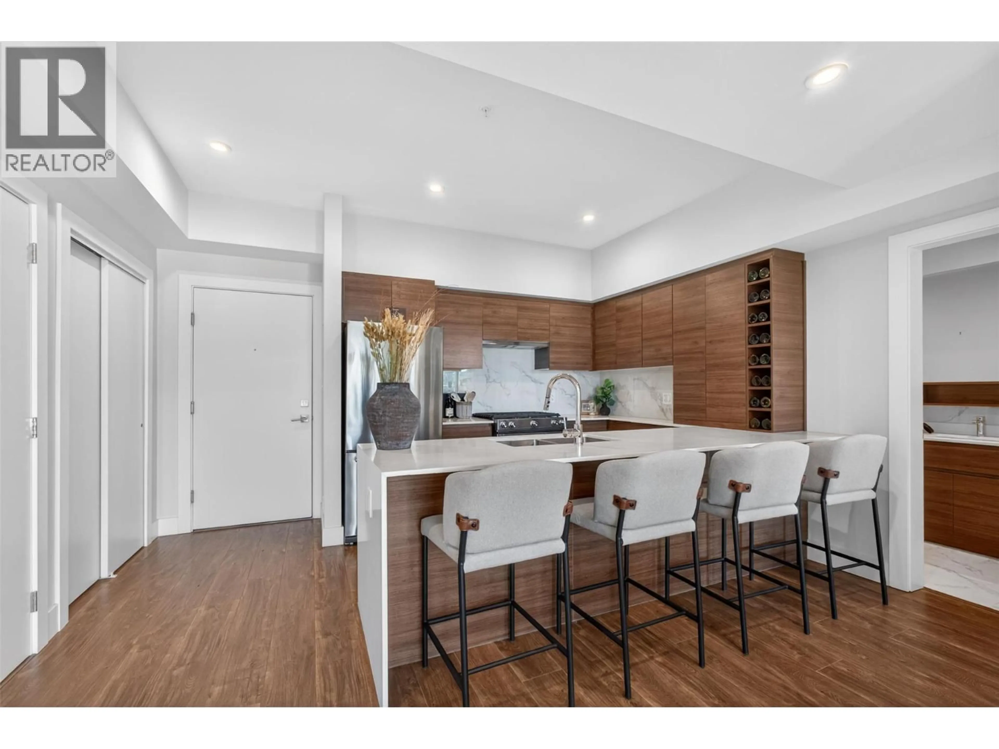 Open concept kitchen, wood/laminate floor for 505 - 1925 ENTERPRISE WAY, Kelowna British Columbia V1Y0J8