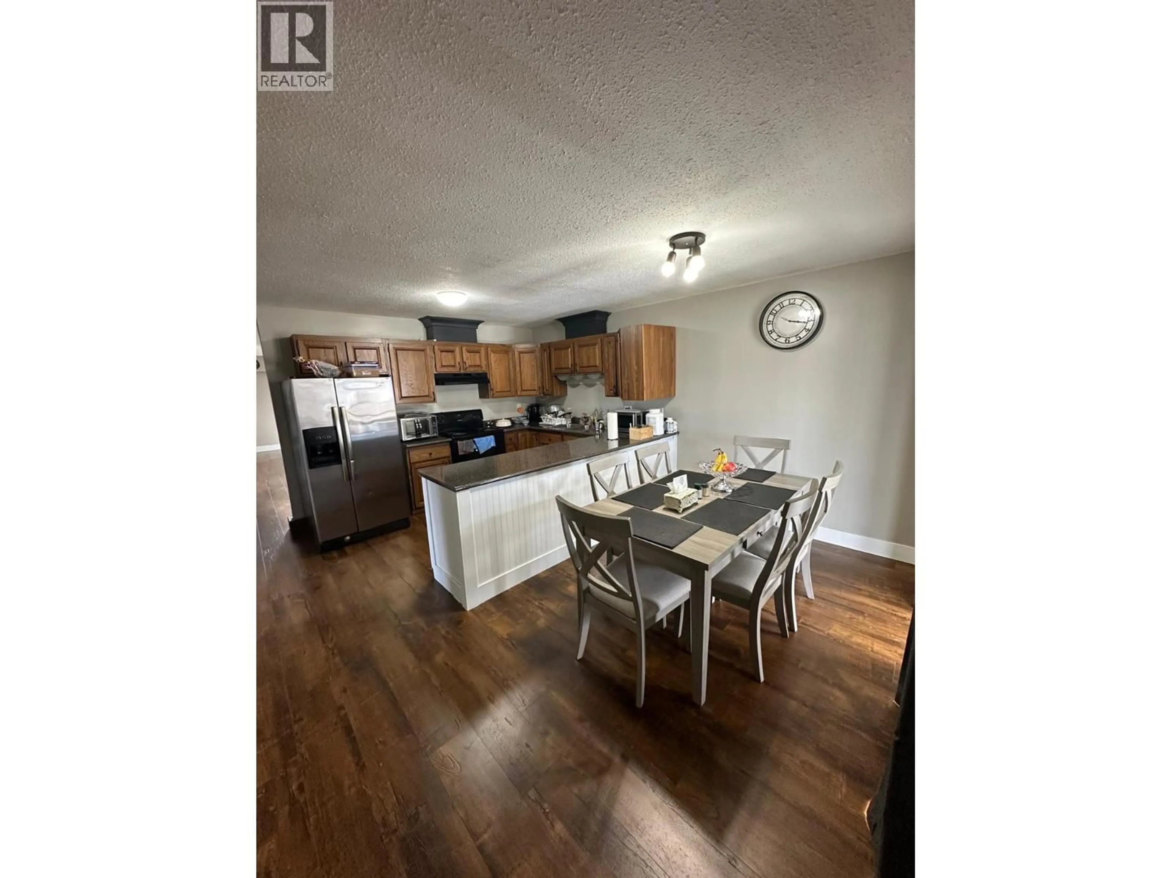 Open concept kitchen, wood/laminate floor for 2563 COLDWATER AVENUE, Merritt British Columbia V1K1B2