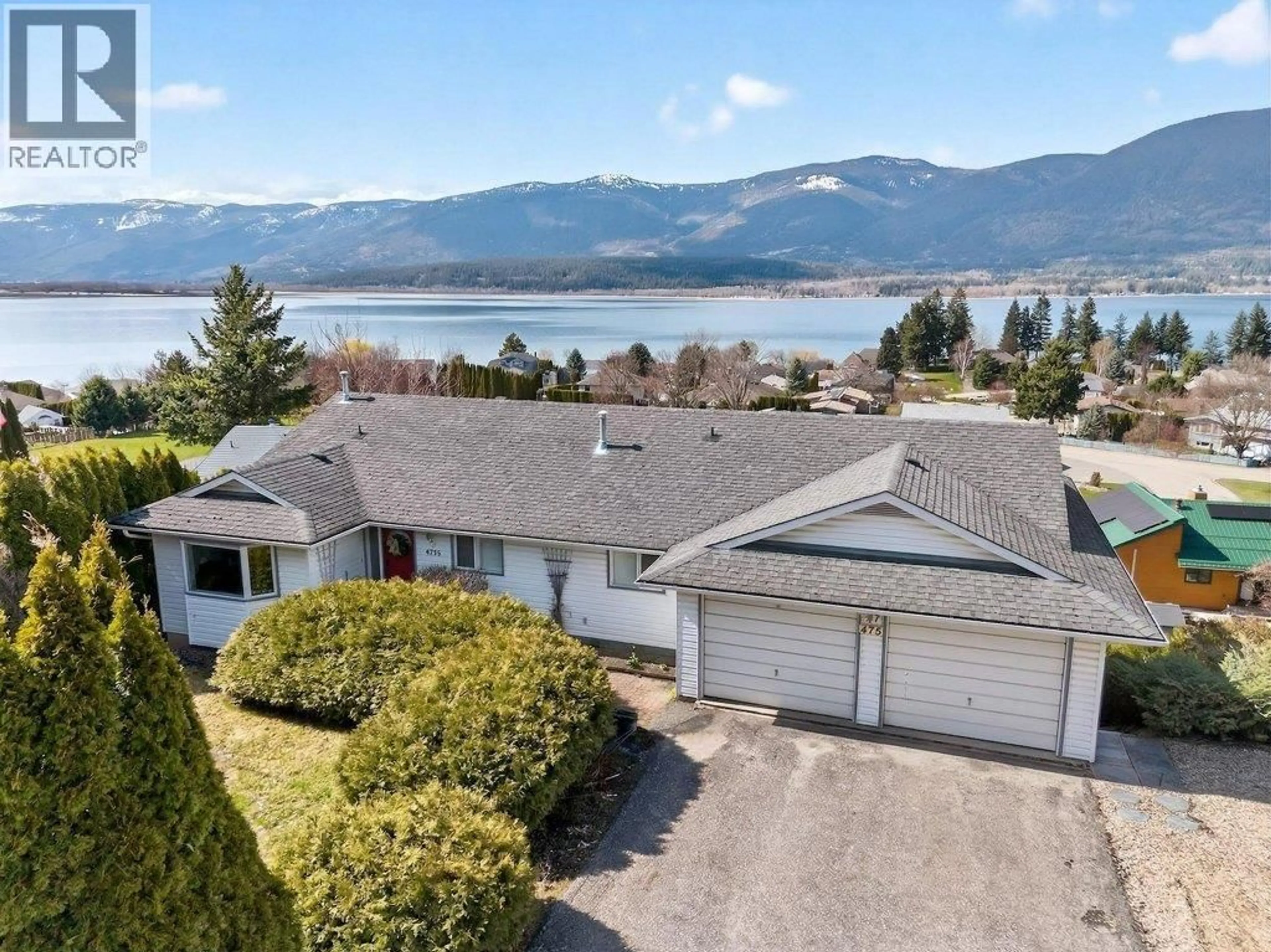 A pic from outside/outdoor area/front of a property/back of a property/a pic from drone, water/lake/river/ocean view for 4751 LAKESHORE ROAD NORTHEAST, Salmon Arm British Columbia V1E3N8