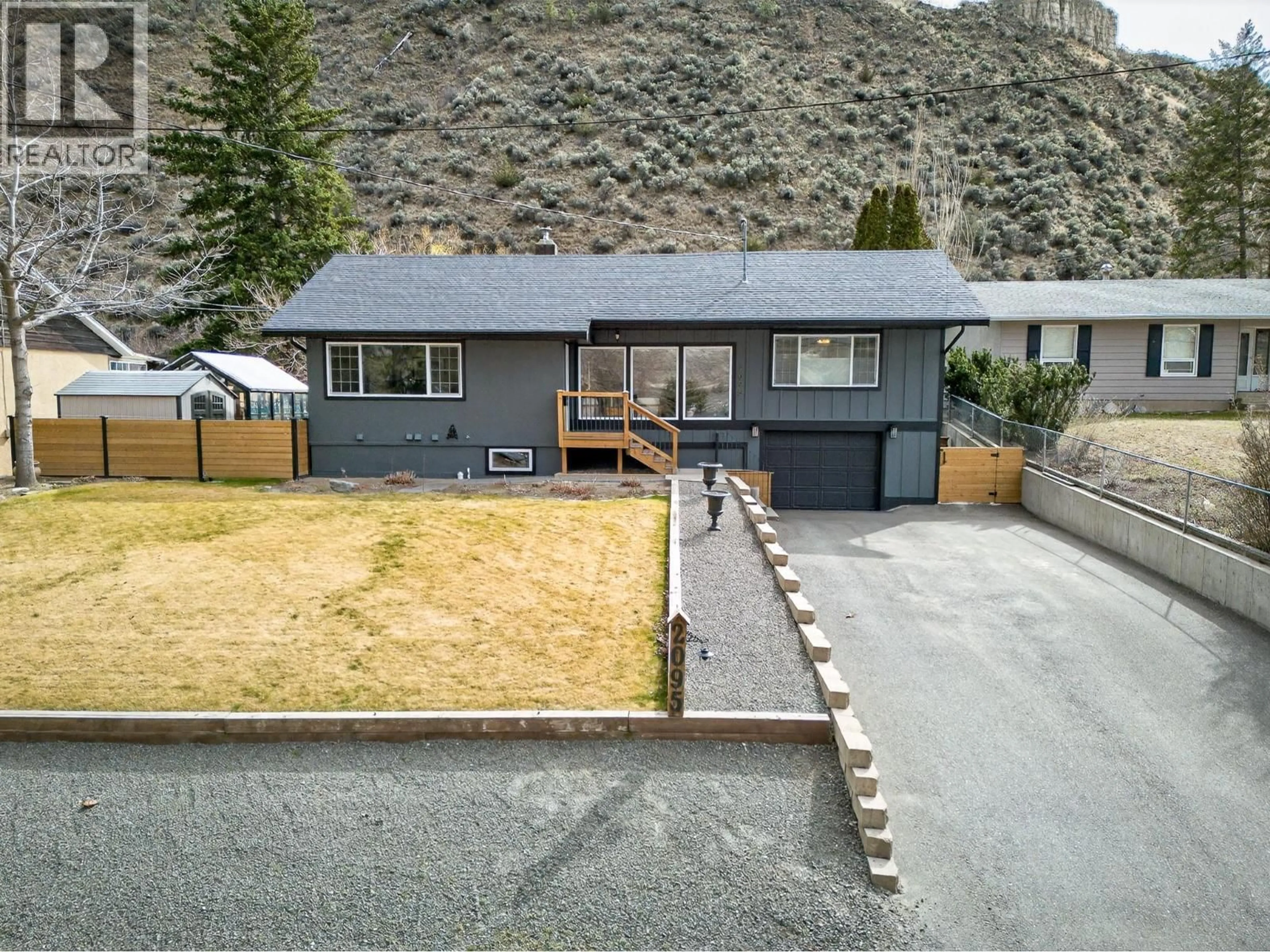 A pic from outside/outdoor area/front of a property/back of a property/a pic from drone, mountain view for 2095 VALLEYVIEW DRIVE, Kamloops British Columbia V2C4C3