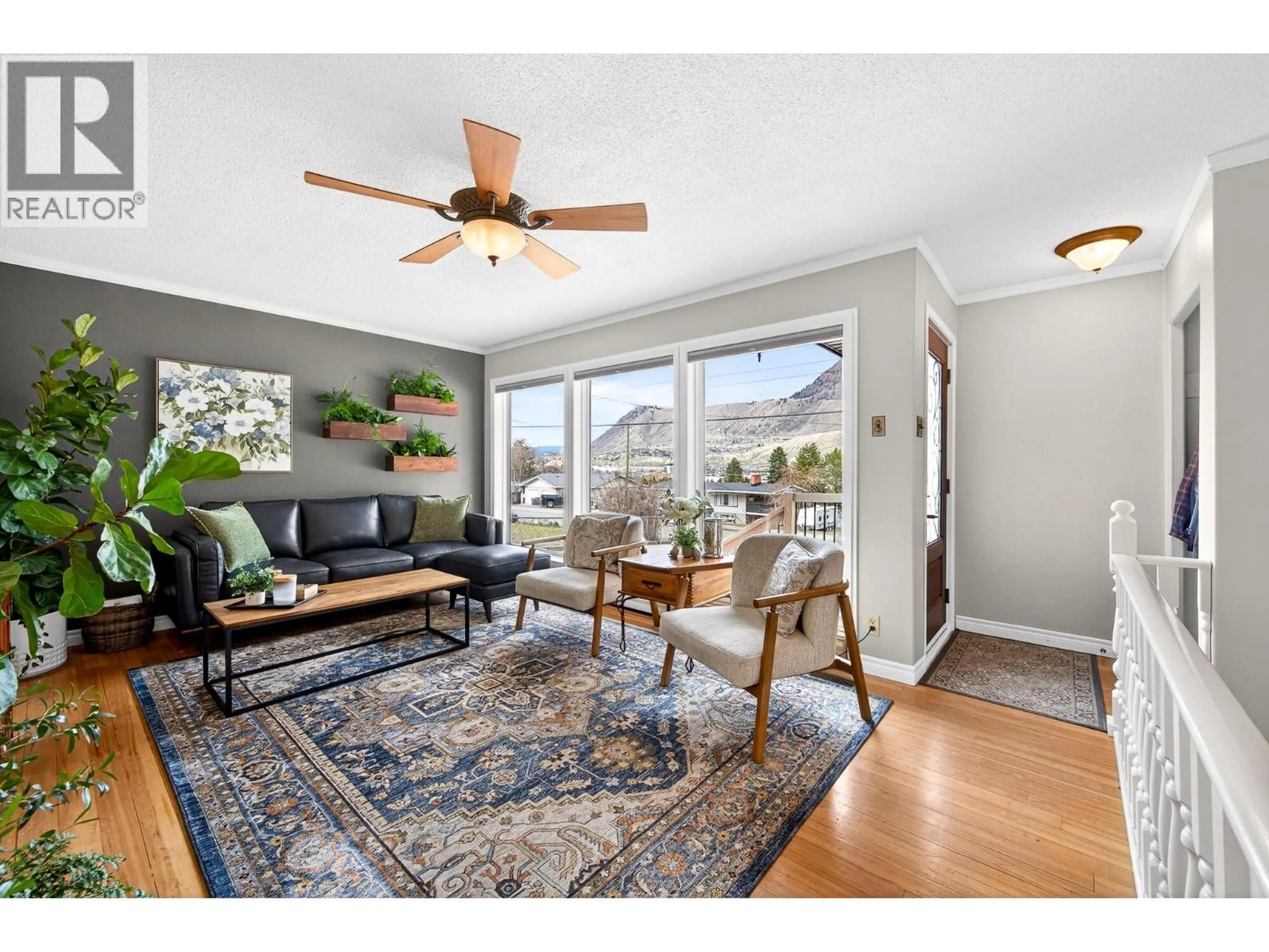Living room with furniture, wood/laminate floor for 2095 VALLEYVIEW DRIVE, Kamloops British Columbia V2C4C3