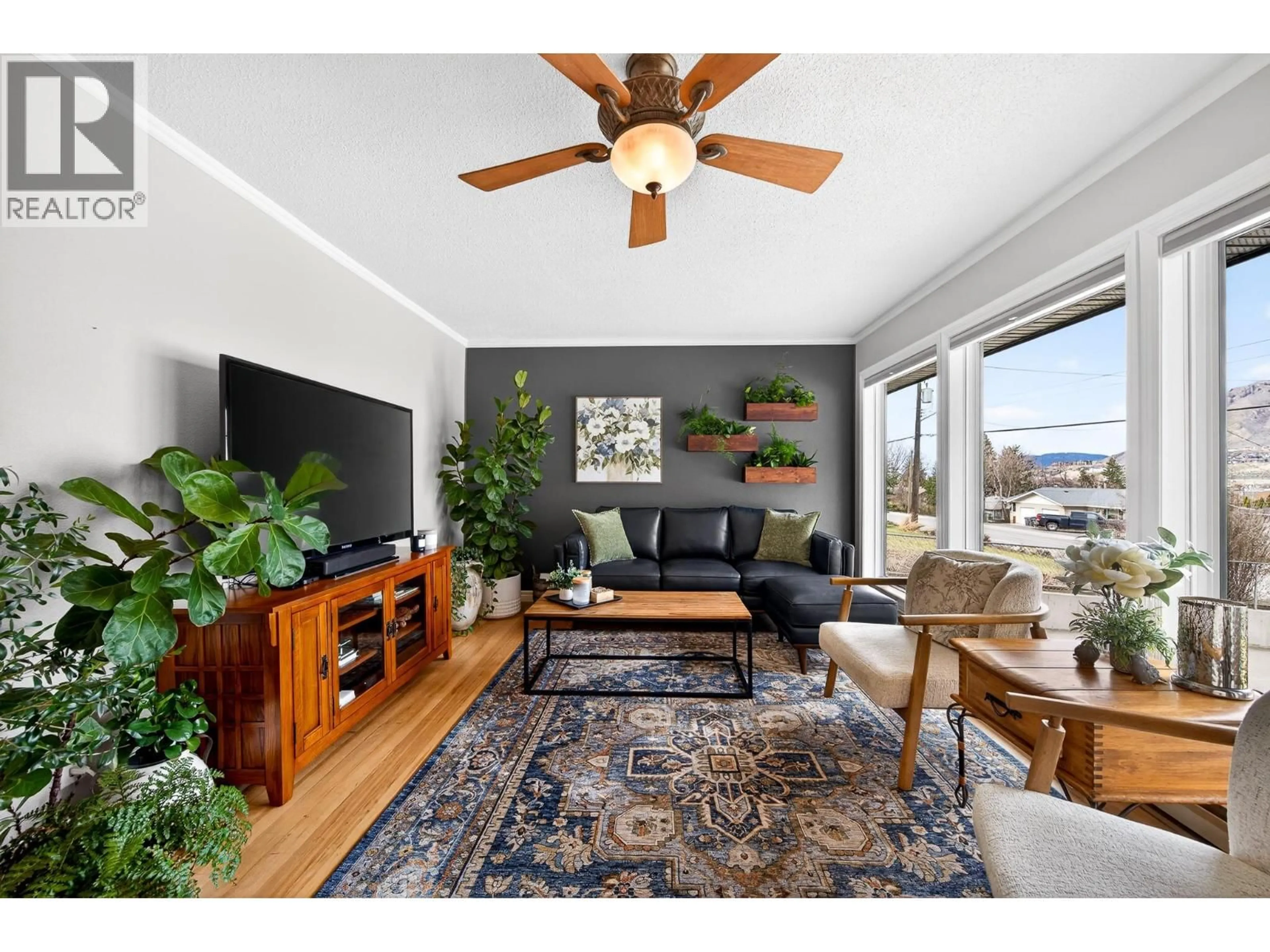 Living room with furniture, wood/laminate floor for 2095 VALLEYVIEW DRIVE, Kamloops British Columbia V2C4C3