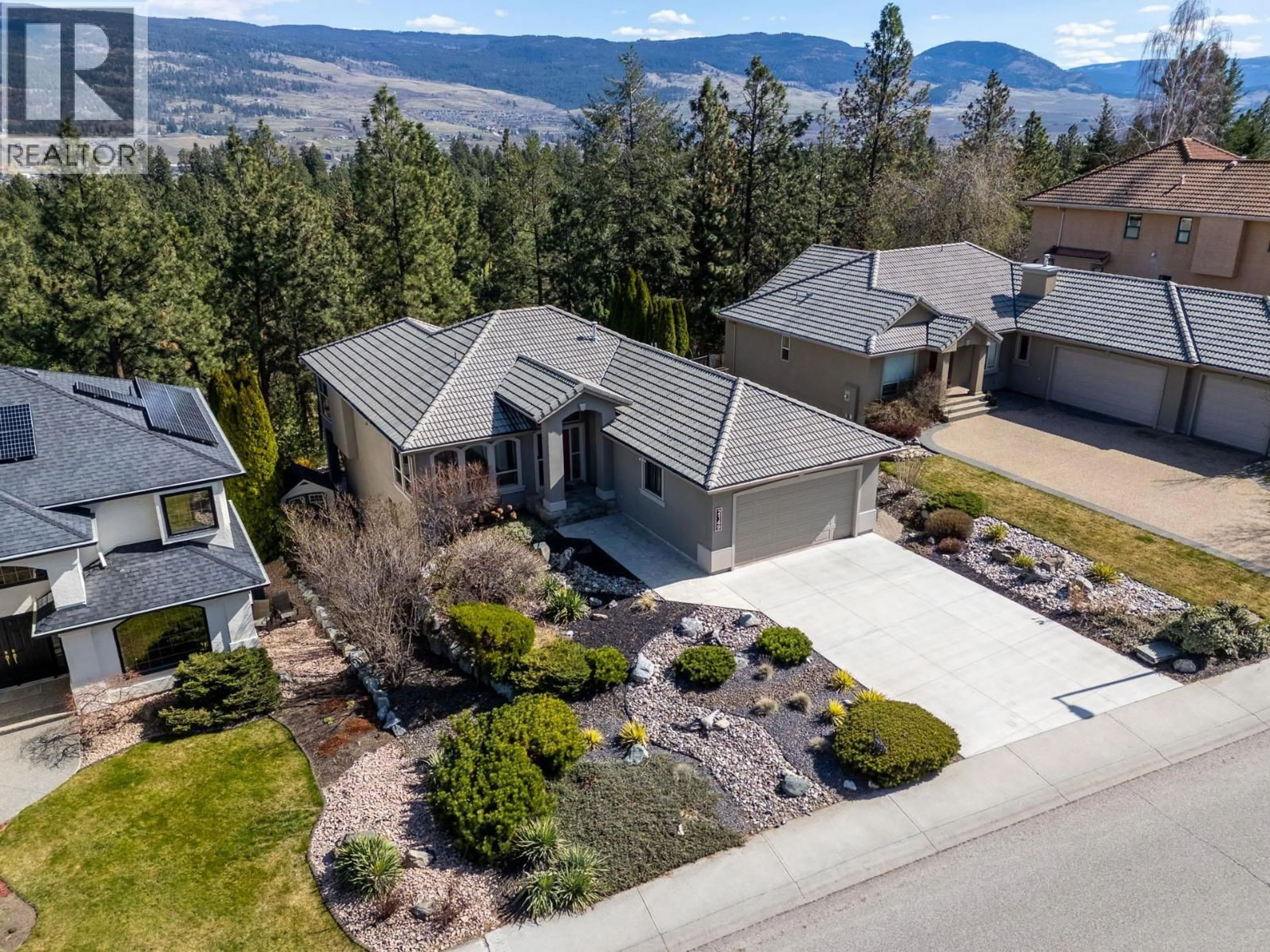A pic from outside/outdoor area/front of a property/back of a property/a pic from drone, mountain view for 2149 CAPISTRANO DRIVE, Kelowna British Columbia V1V2A3