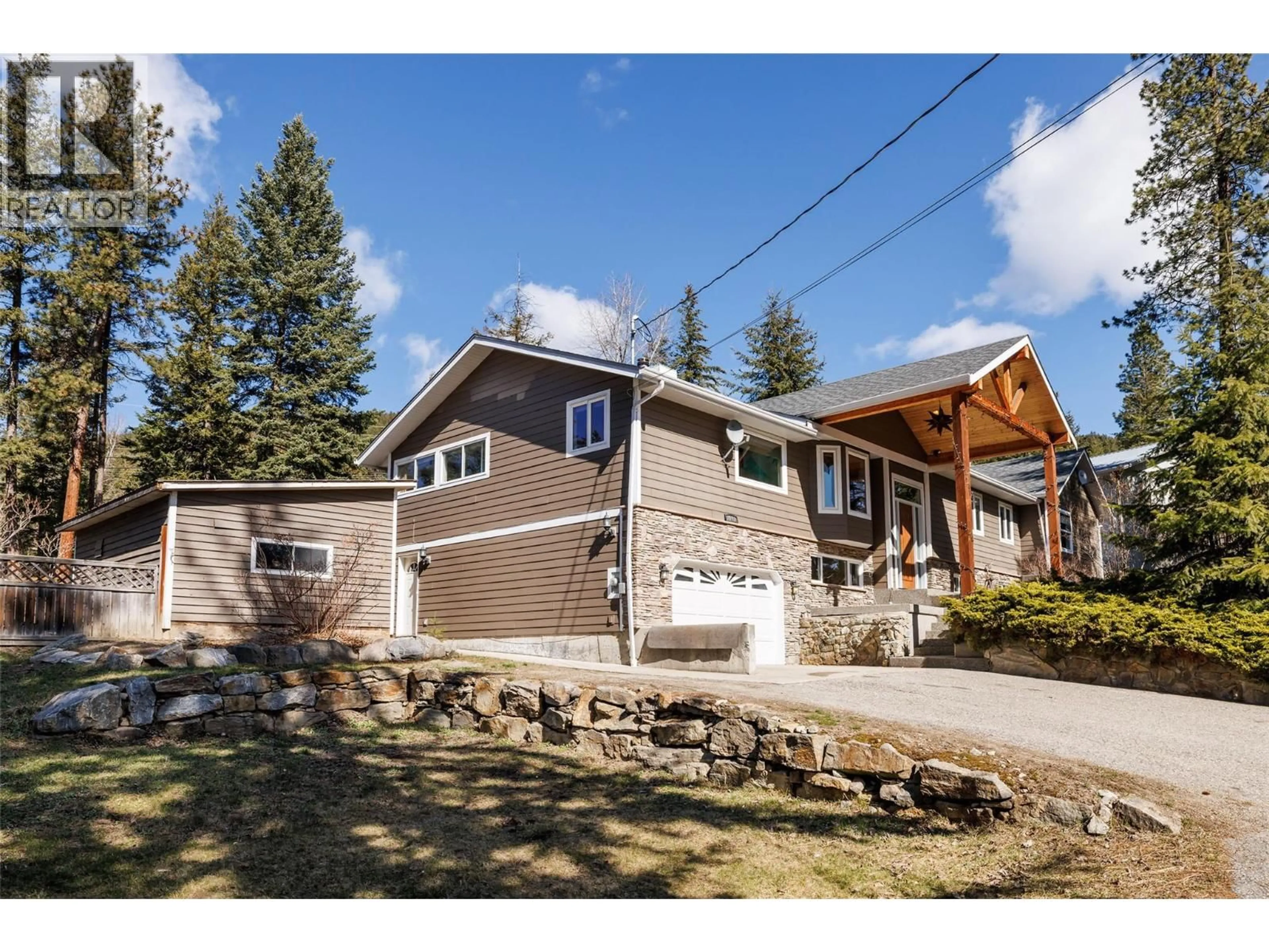 Home with vinyl exterior material, street for 7992 FALCON RIDGE CRESCENT, Kelowna British Columbia V1P1J2