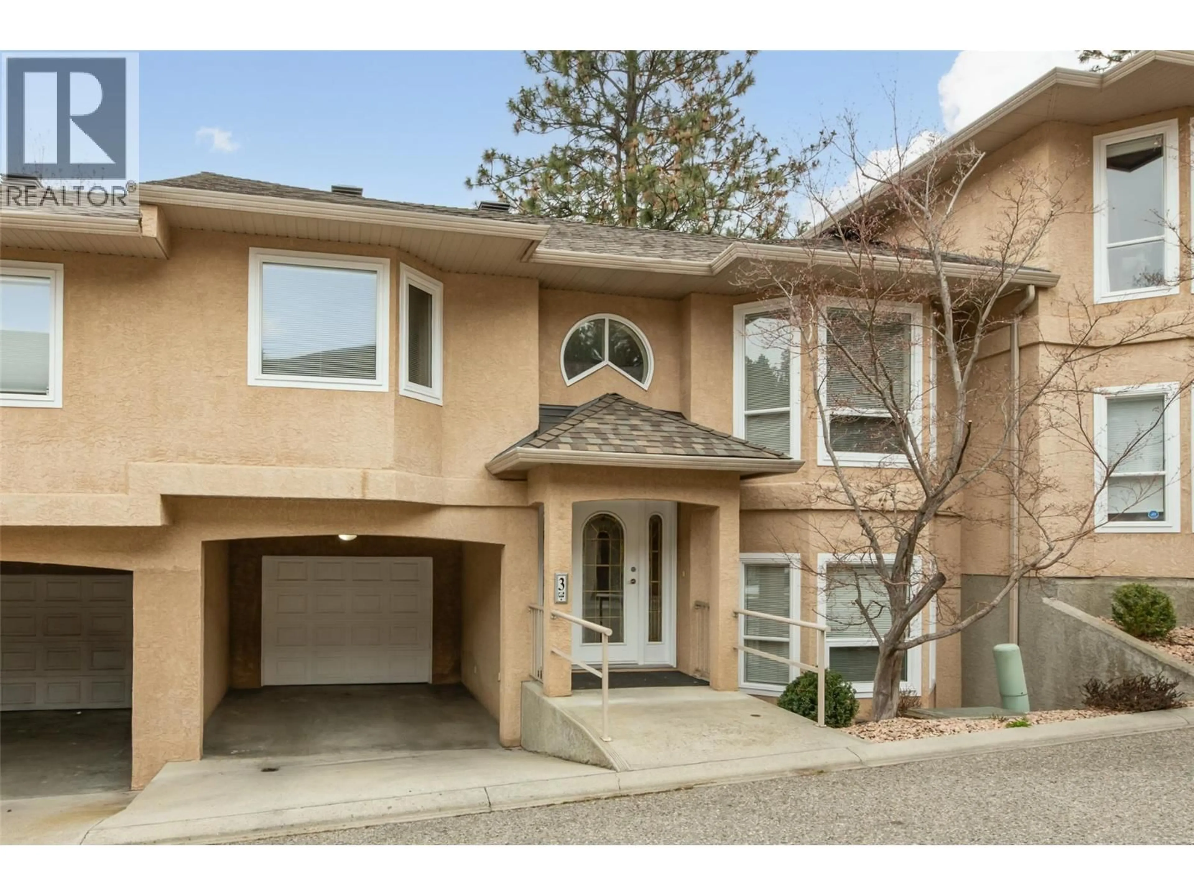 Home with brick exterior material, street for 3 - 2425 MOUNT BALDY DRIVE, Kelowna British Columbia V1V1Z3