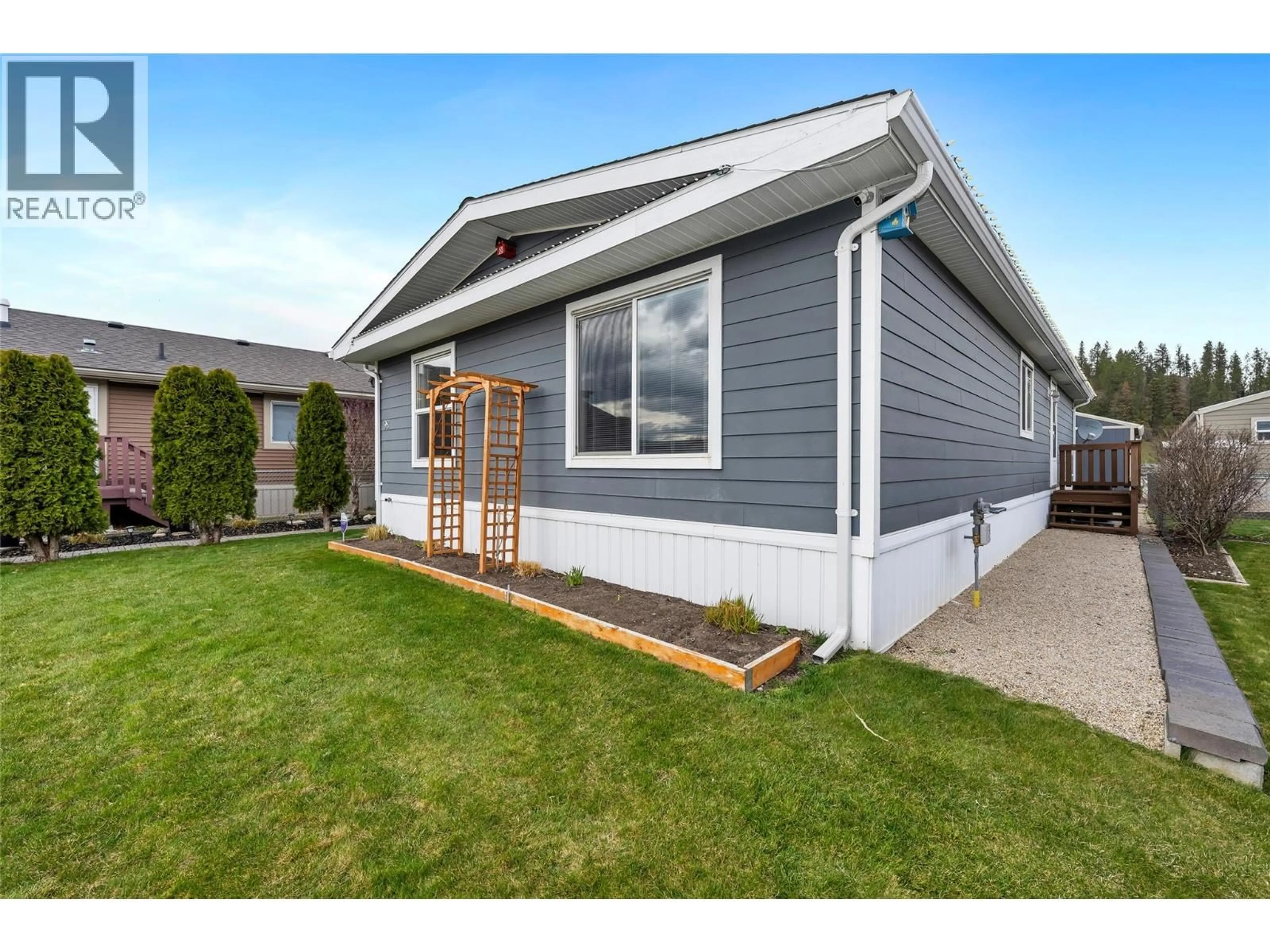 Home with vinyl exterior material, street for 98 12560 WESTSIDE ROAD, Vernon British Columbia V1H1S9