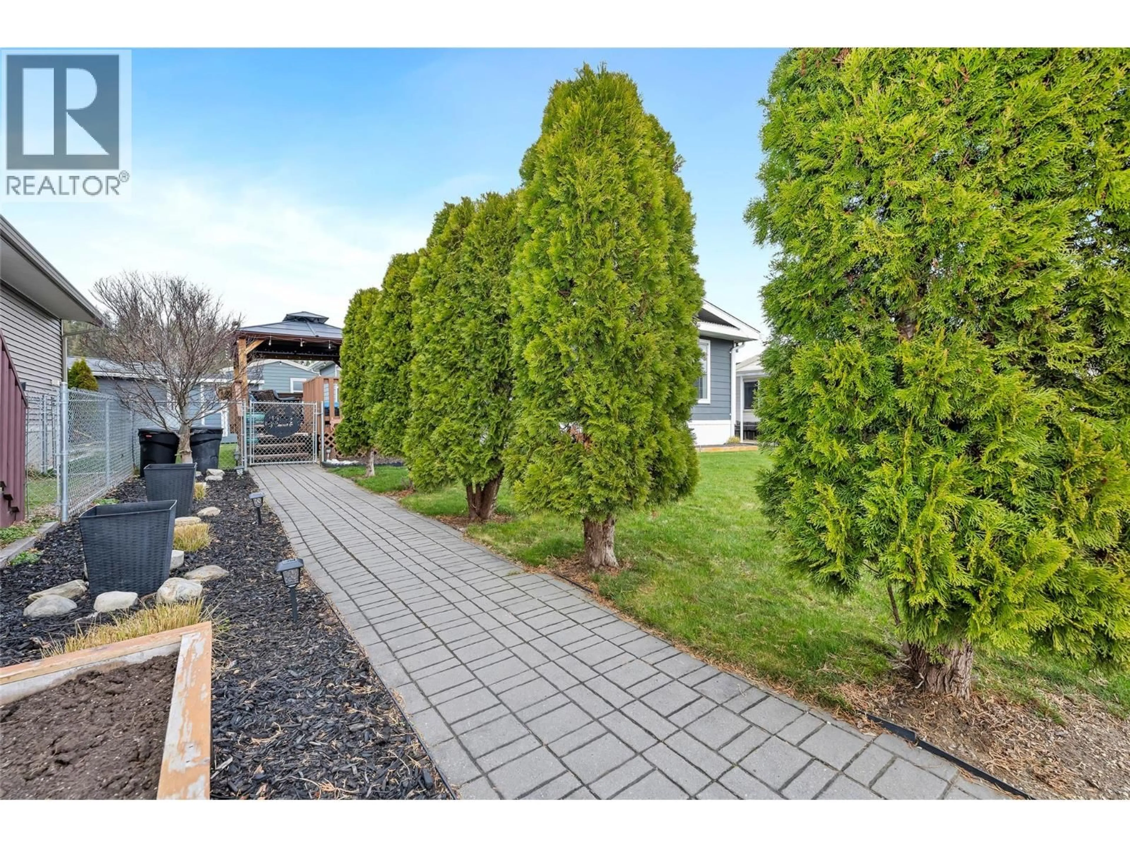 A pic from outside/outdoor area/front of a property/back of a property/a pic from drone, street for 98 12560 WESTSIDE ROAD, Vernon British Columbia V1H1S9