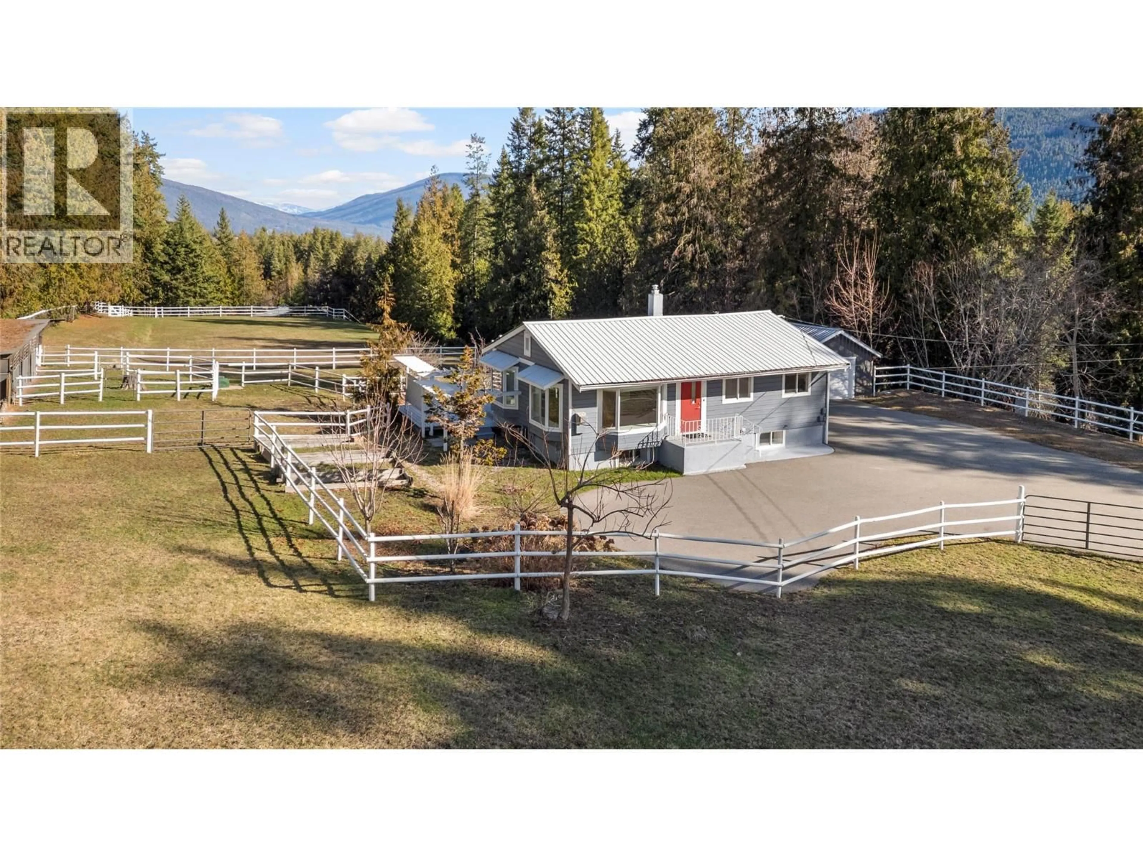 A pic from outside/outdoor area/front of a property/back of a property/a pic from drone, mountain view for 4091 10 AVENUE SOUTHEAST, Salmon Arm British Columbia V1E1W7