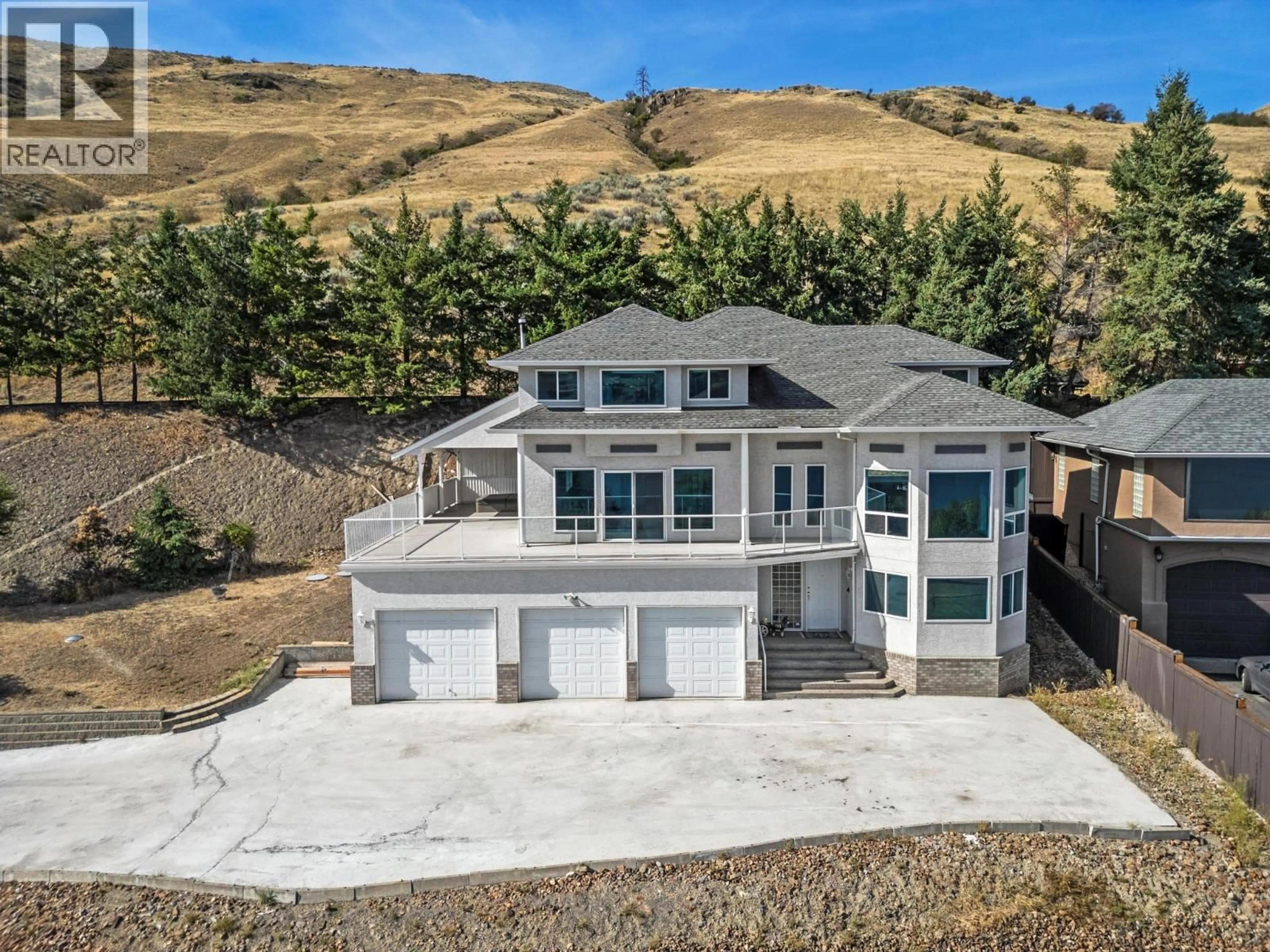 A pic from outside/outdoor area/front of a property/back of a property/a pic from drone, mountain view for 7967 TRONSON ROAD, Vernon British Columbia V1H1C6