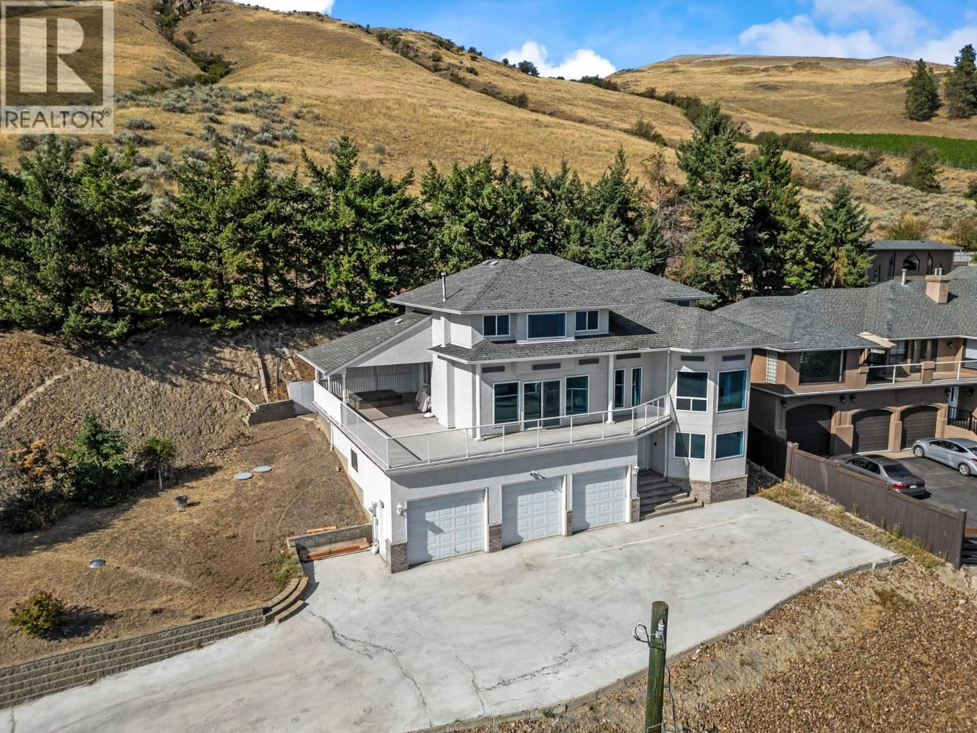 A pic from outside/outdoor area/front of a property/back of a property/a pic from drone, mountain view for 7967 TRONSON ROAD, Vernon British Columbia V1H1C6