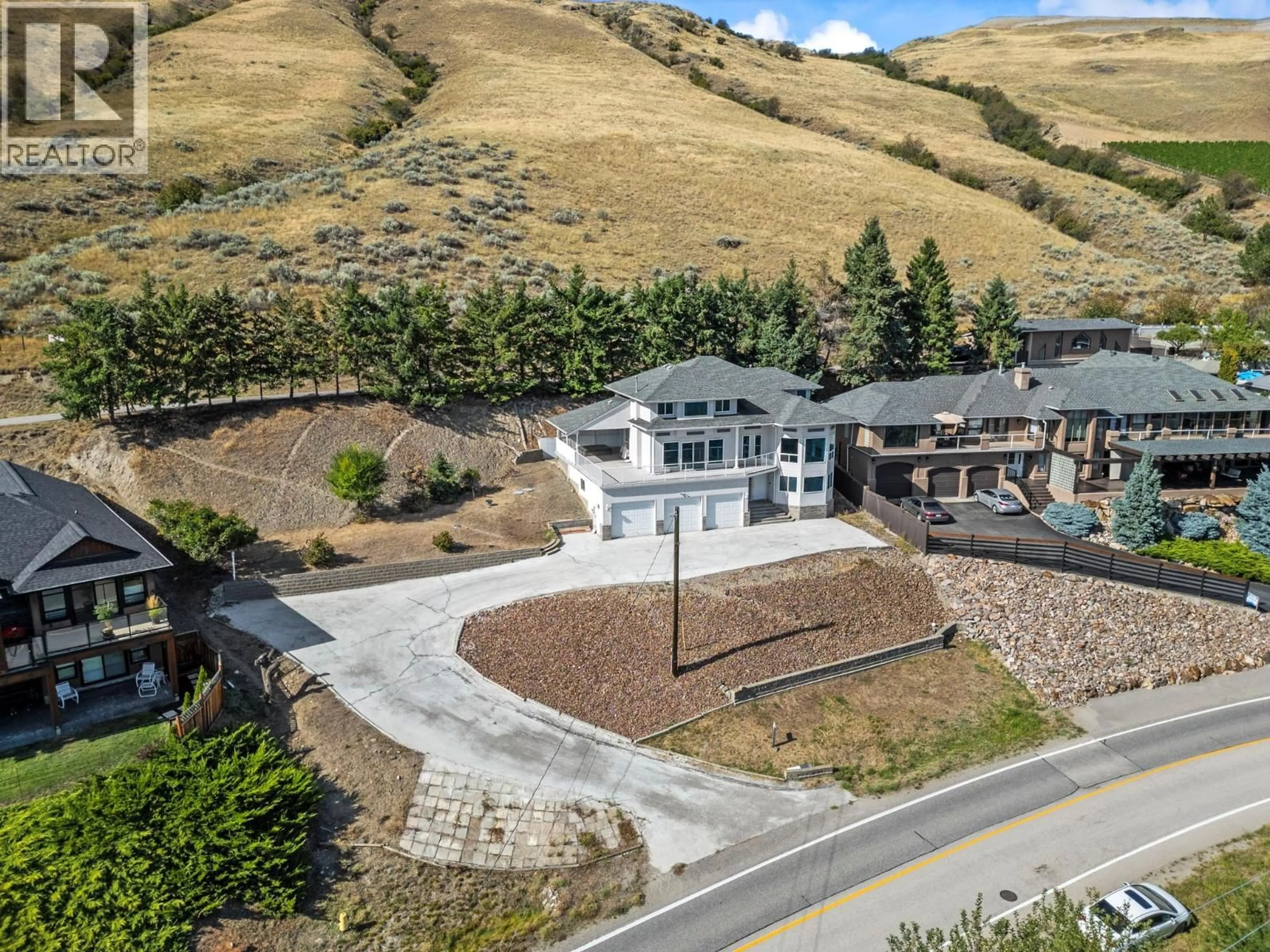 A pic from outside/outdoor area/front of a property/back of a property/a pic from drone, mountain view for 7967 TRONSON ROAD, Vernon British Columbia V1H1C6