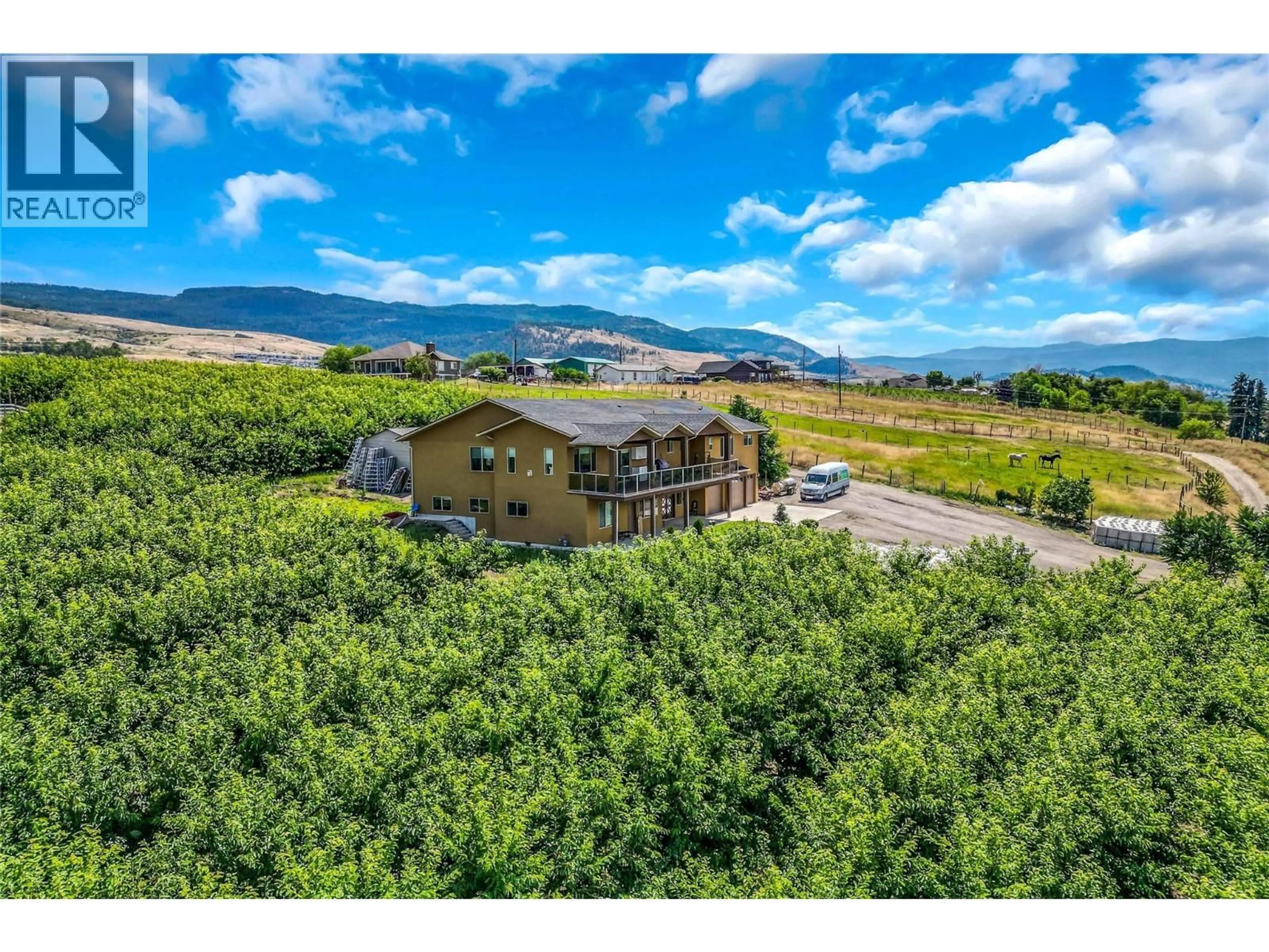 A pic from outside/outdoor area/front of a property/back of a property/a pic from drone, mountain view for 4561 RITTICH ROAD, Kelowna British Columbia V1X7V6