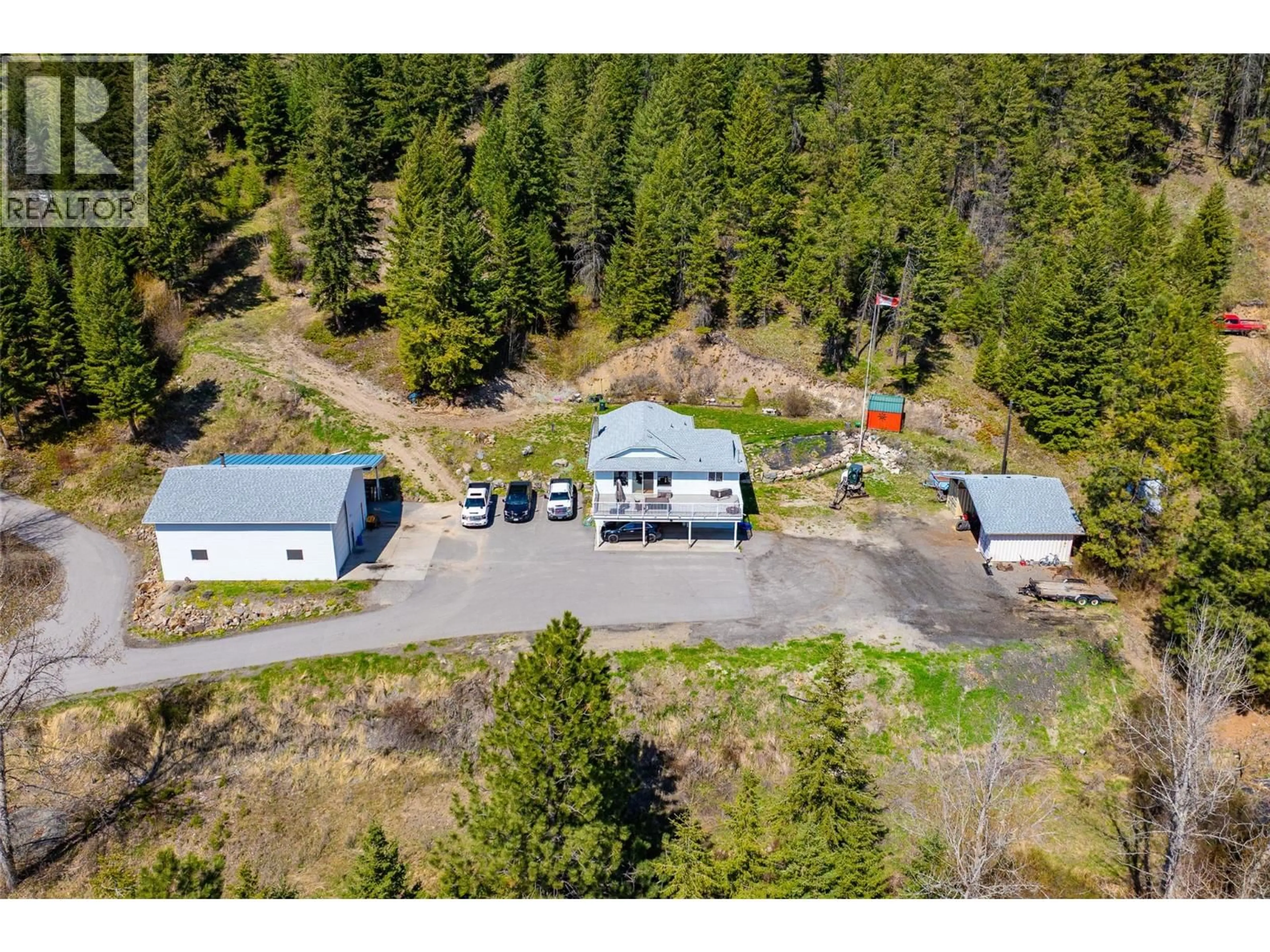 A pic from outside/outdoor area/front of a property/back of a property/a pic from drone, unknown for 7114 GOSHAWK ROAD, Kelowna British Columbia V1P1H9